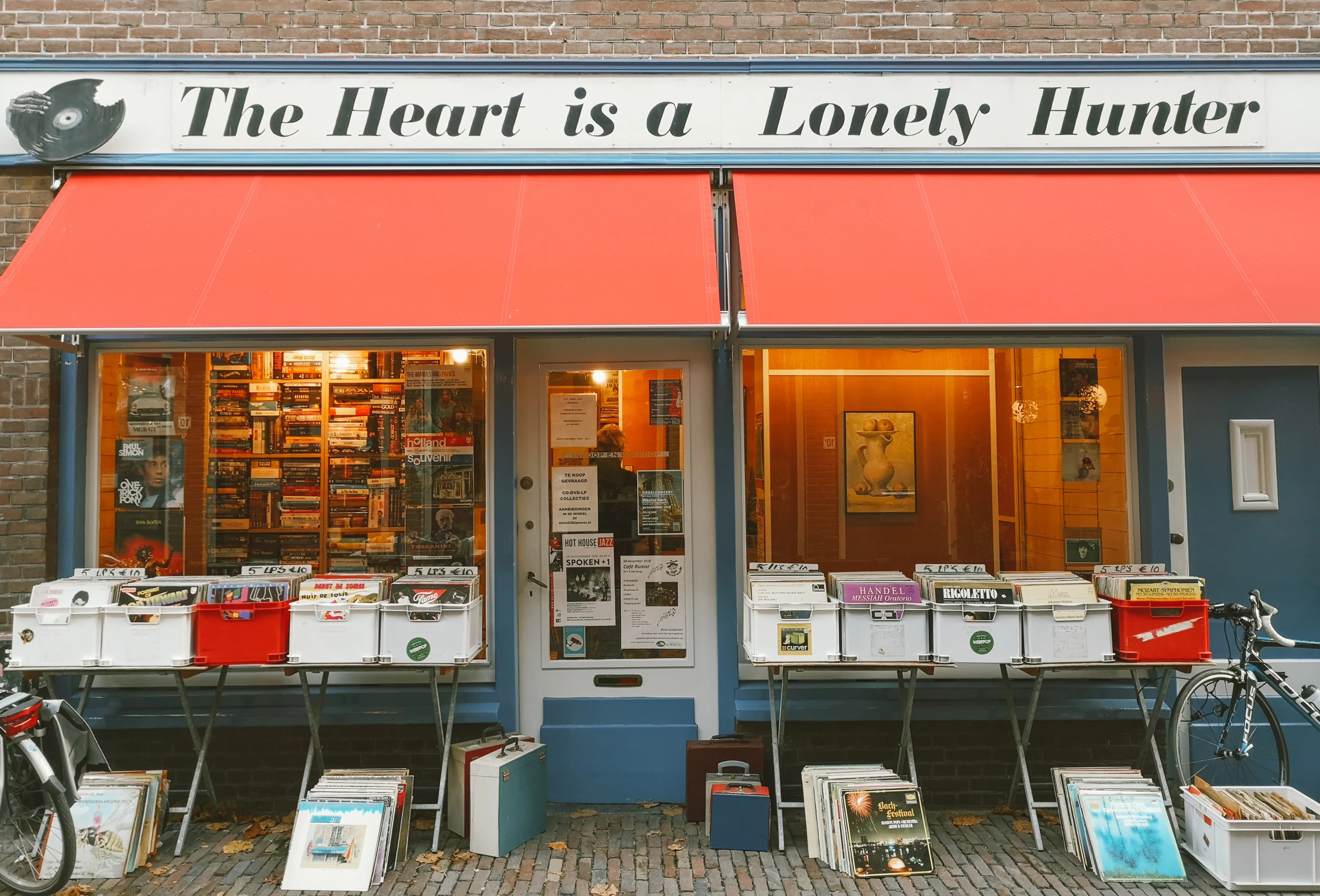 a store front with a bicycle parked in front of it