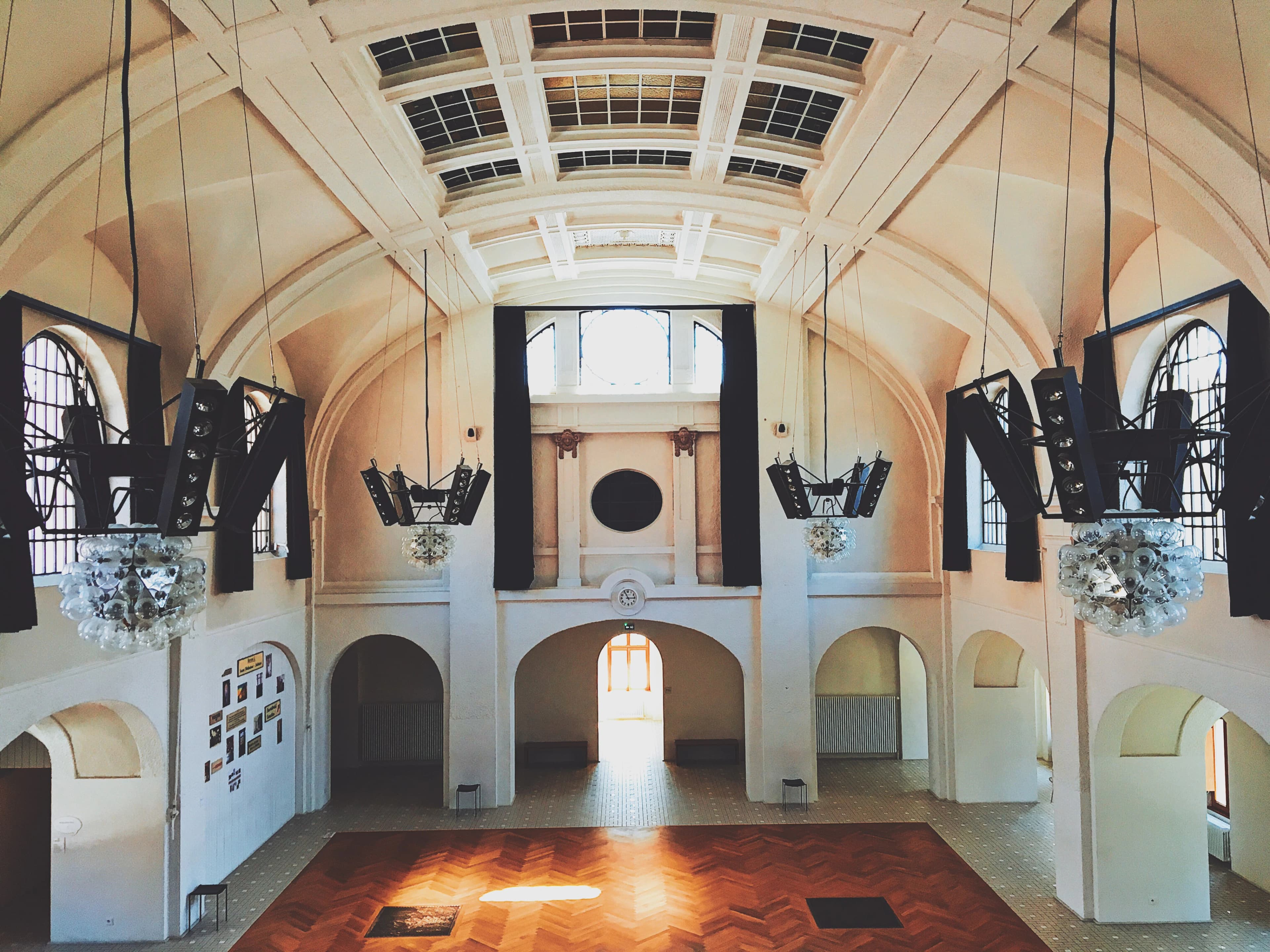 A large room with high ceilings and high windows