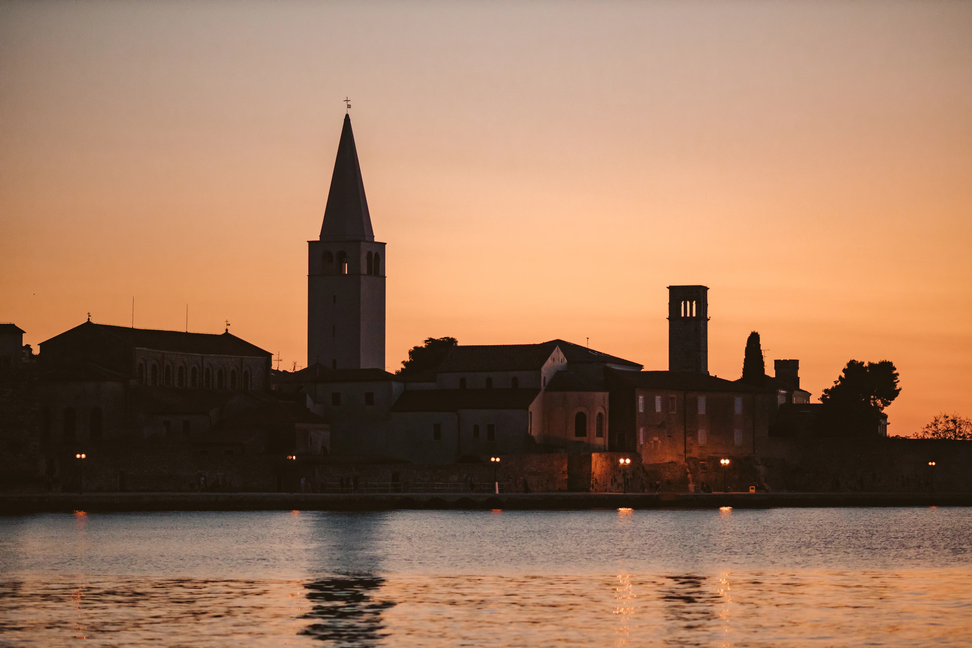 A large body of water with a city in the background