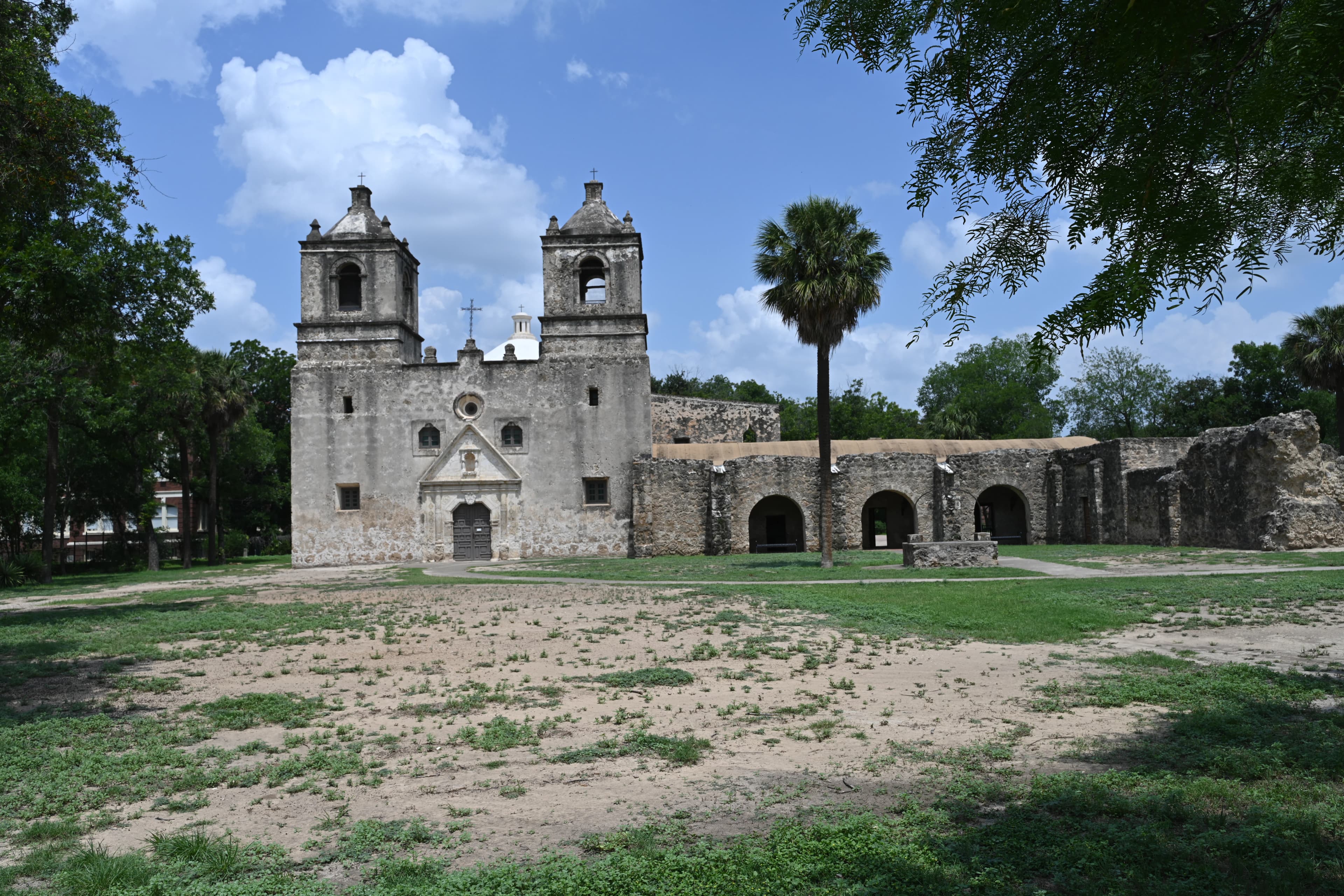 An old stone church stands proudly in the sunlight.