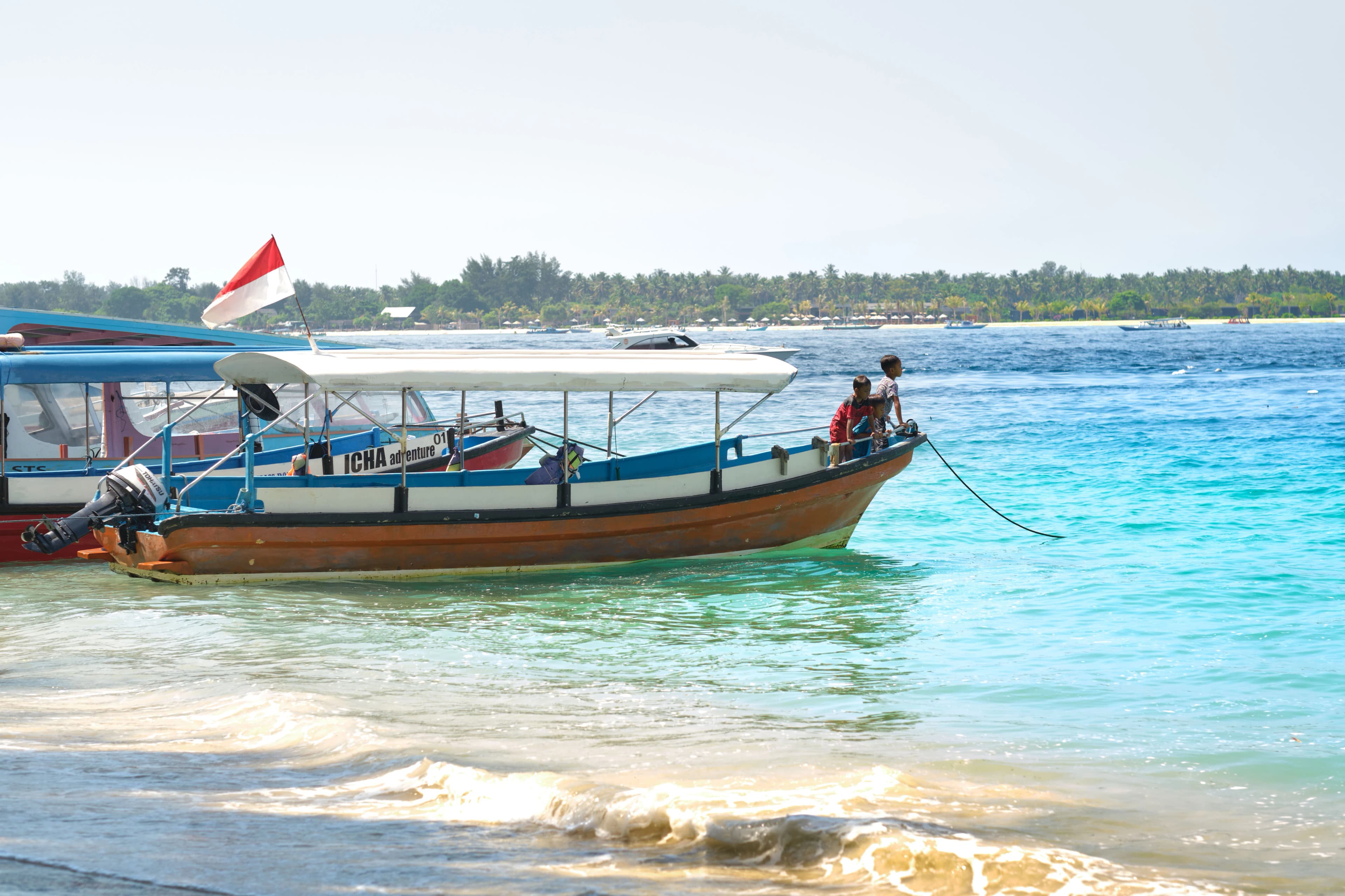 A couple of boats that are sitting in the water