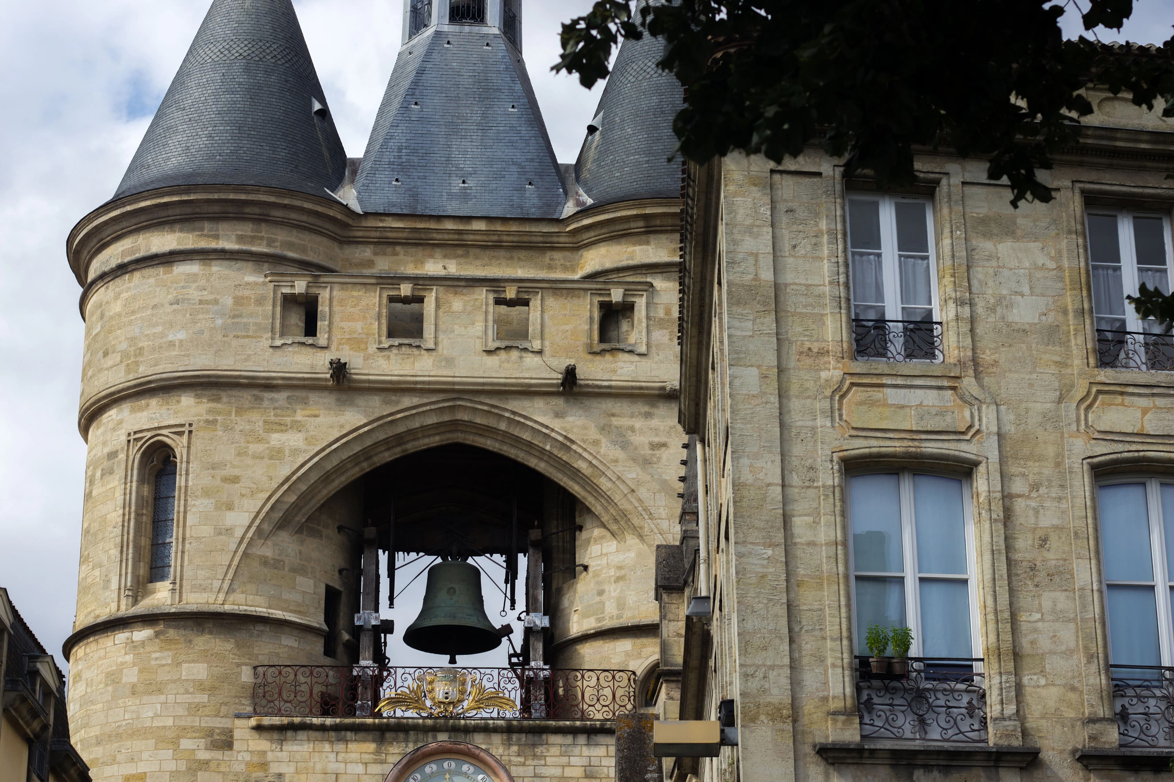 a clock on the side of a building with a tower
