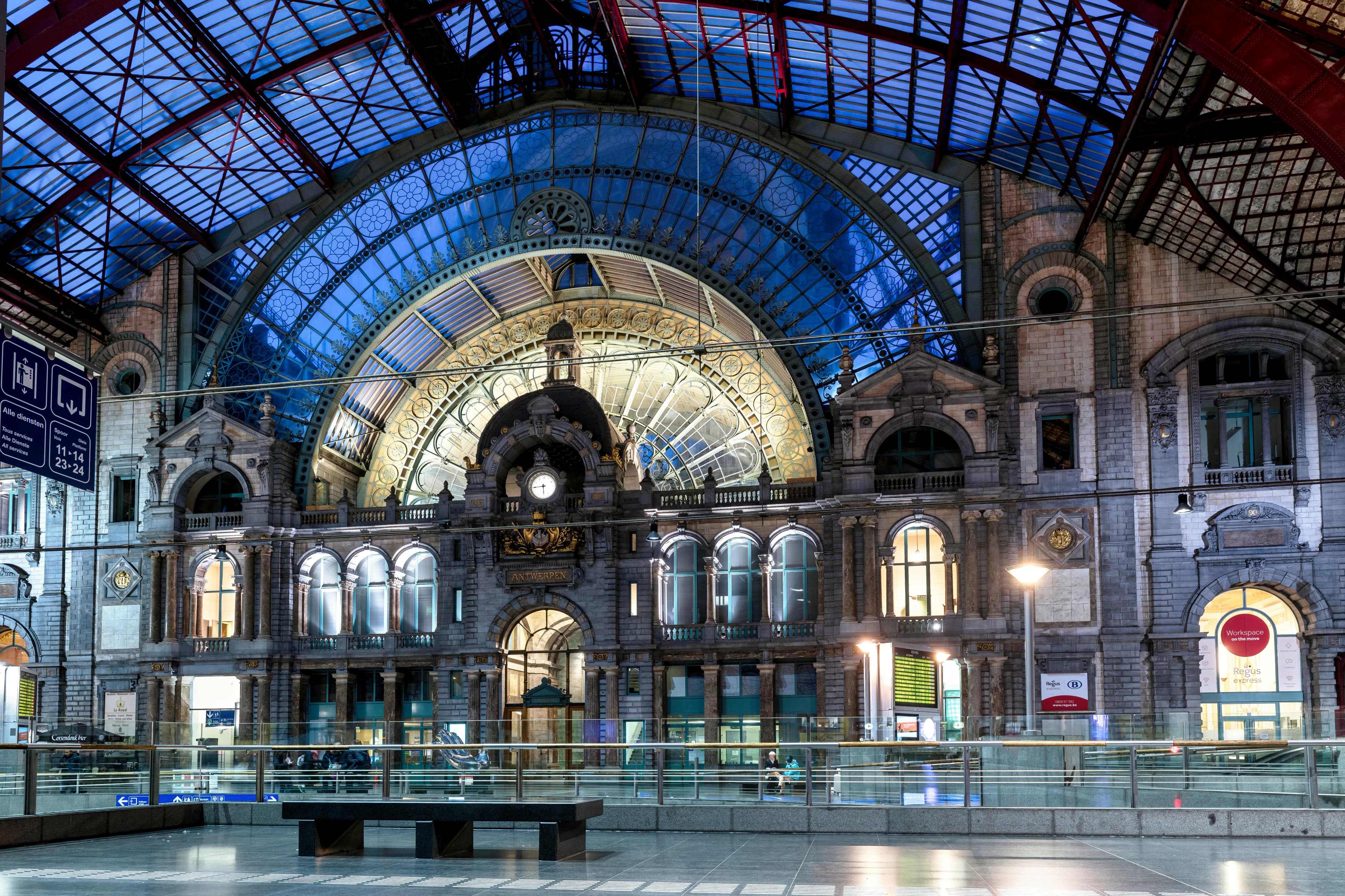 Grand interior of a historic train station at night
