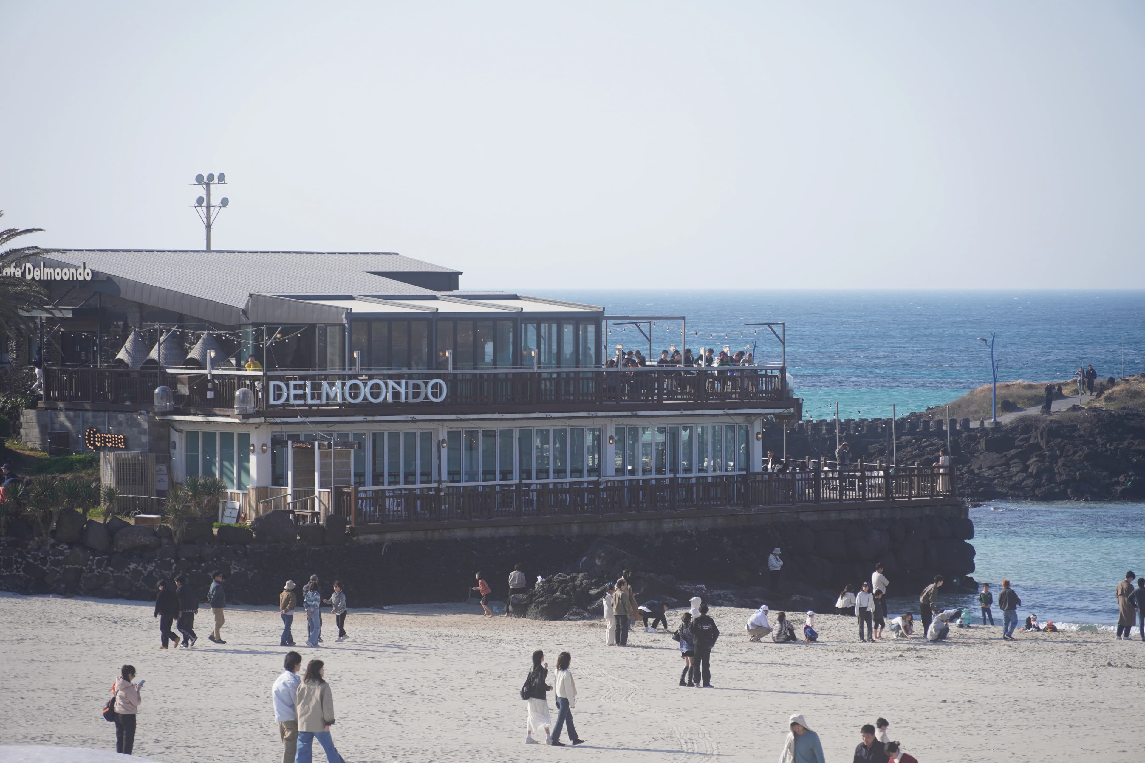 A beachside restaurant overlooks the ocean.