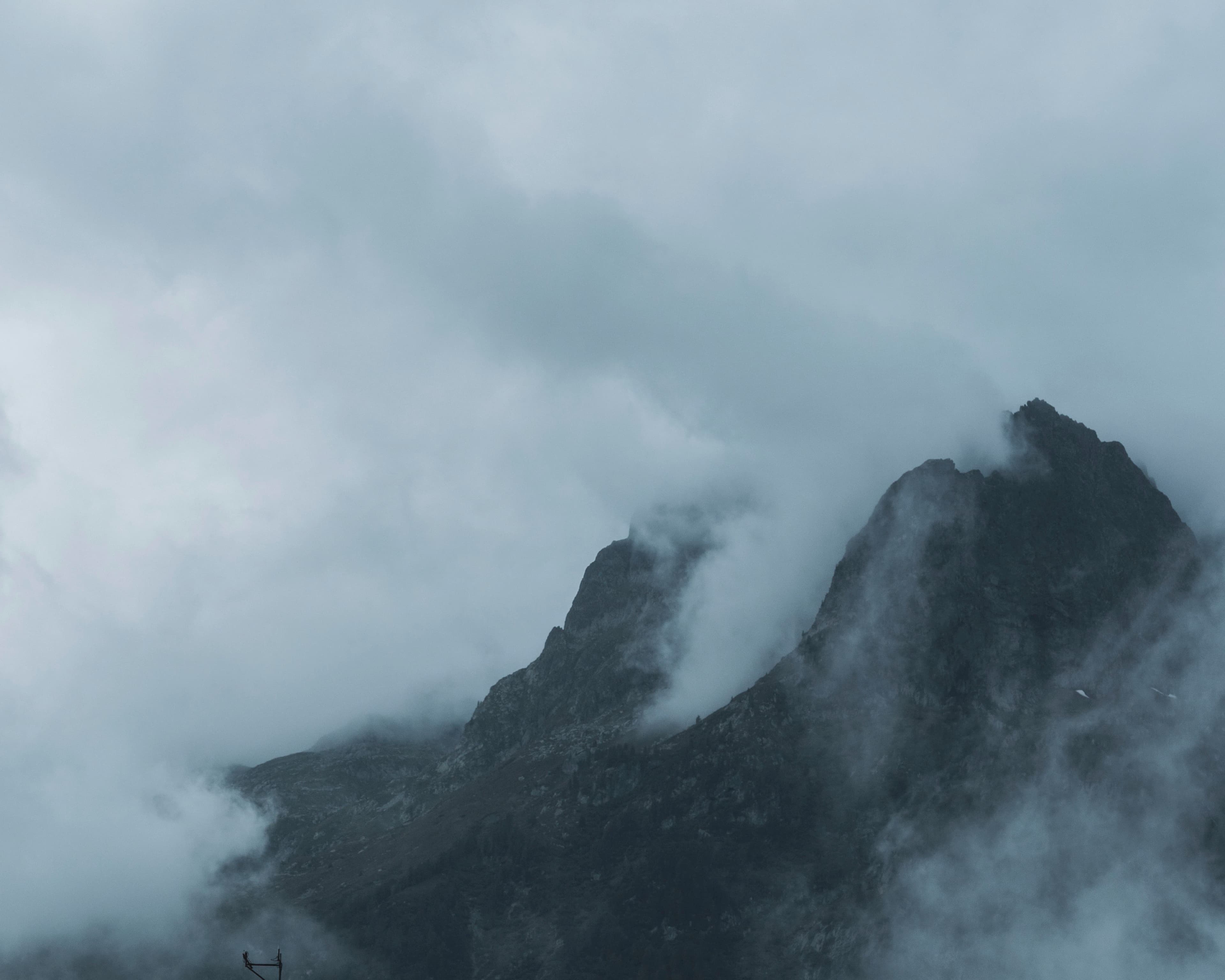 black and gray mountain under white clouds
