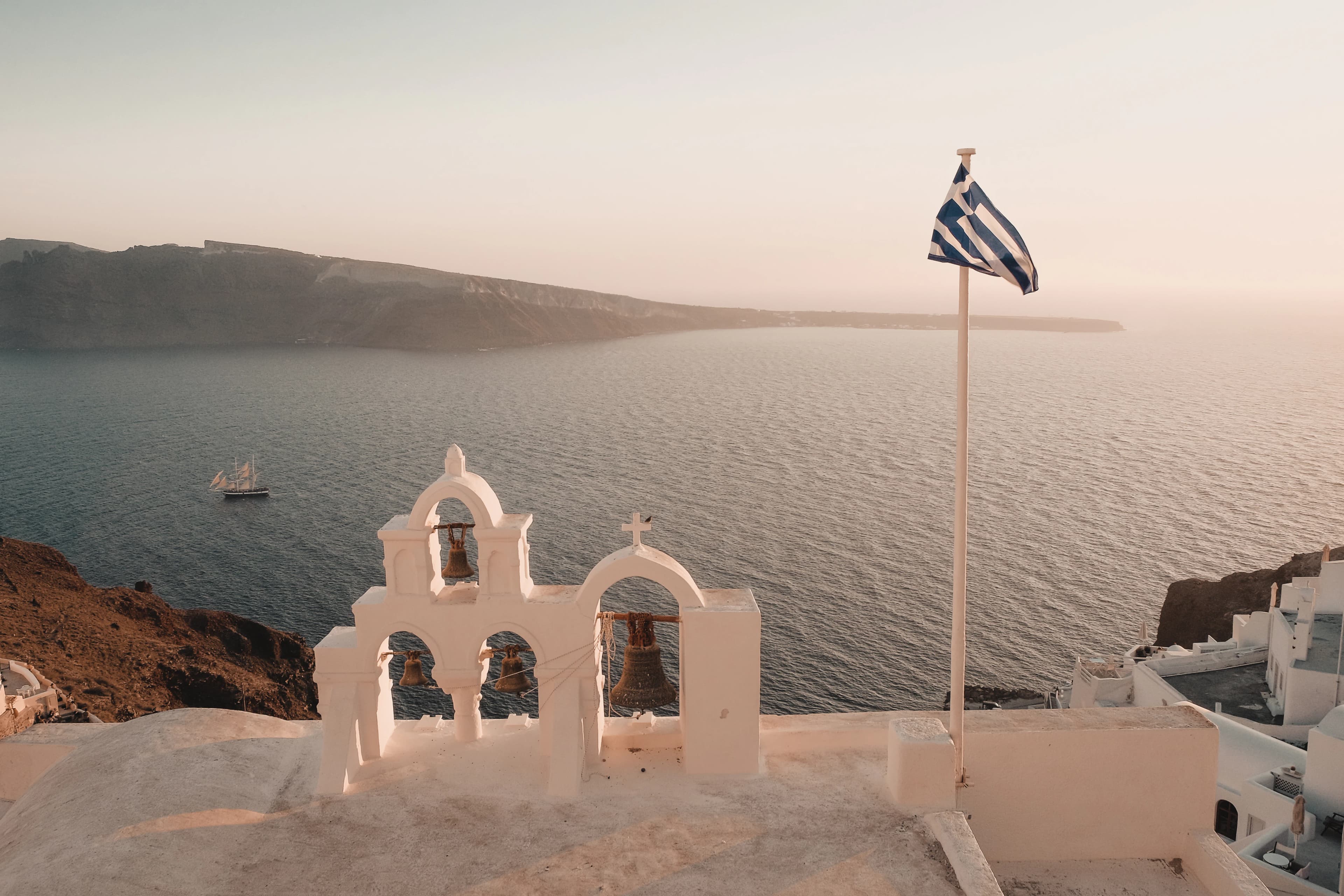 white concrete building near sea during daytime