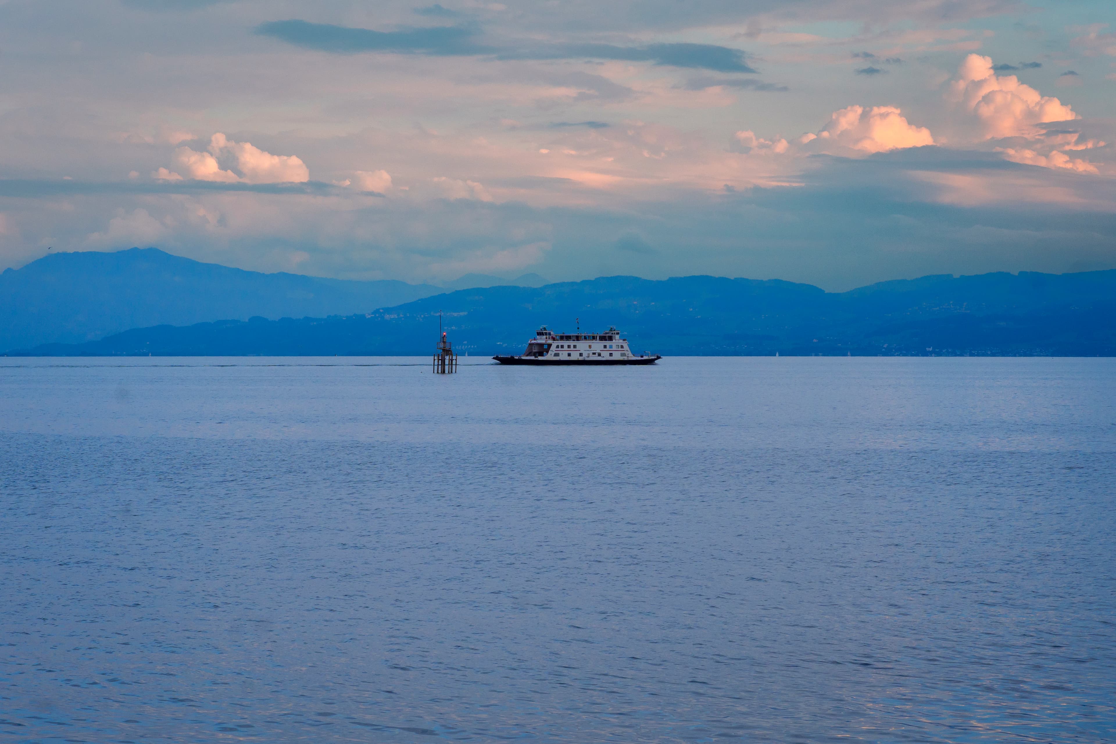 A large boat floating on top of a large body of water