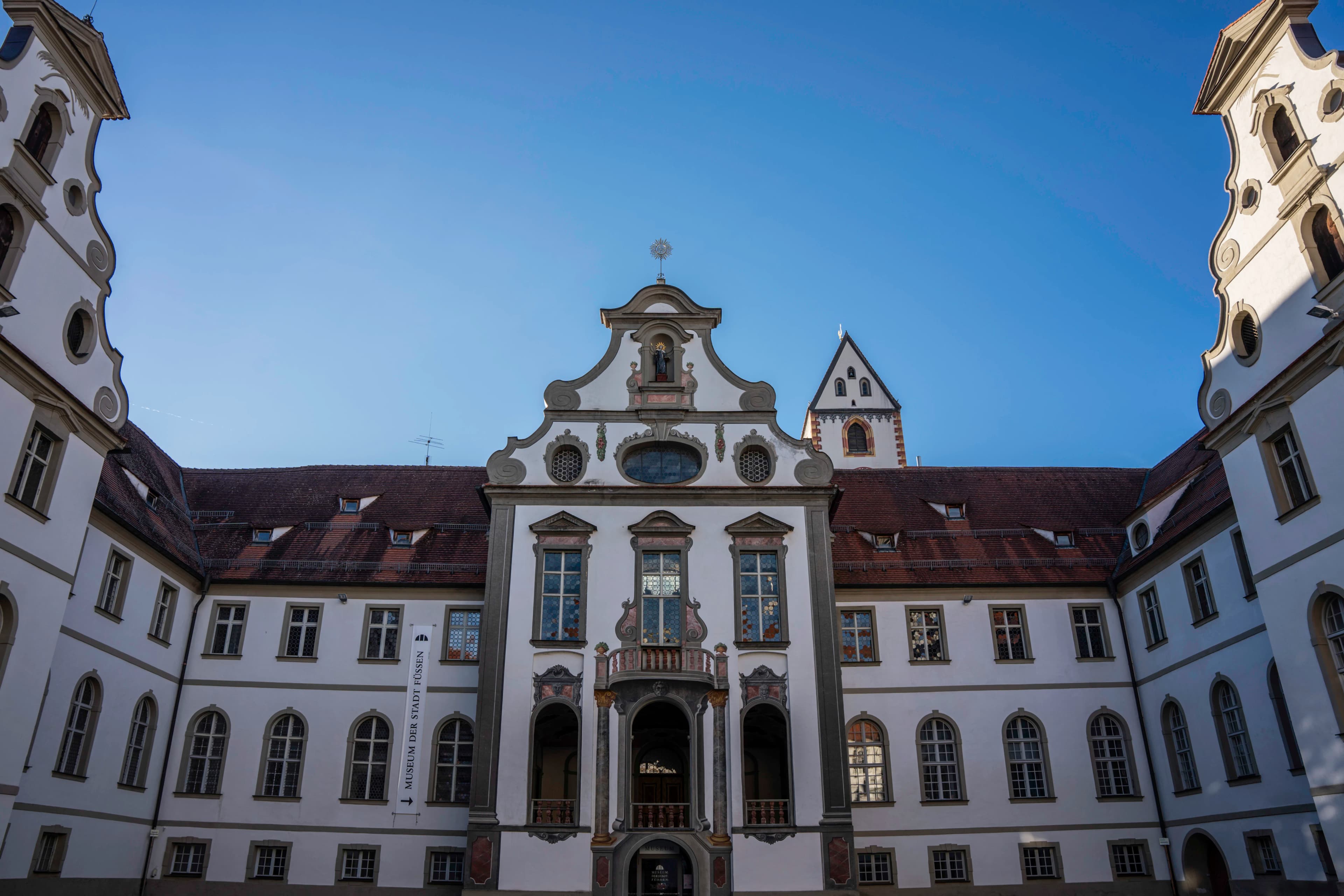 A large building with a clock on the front of it