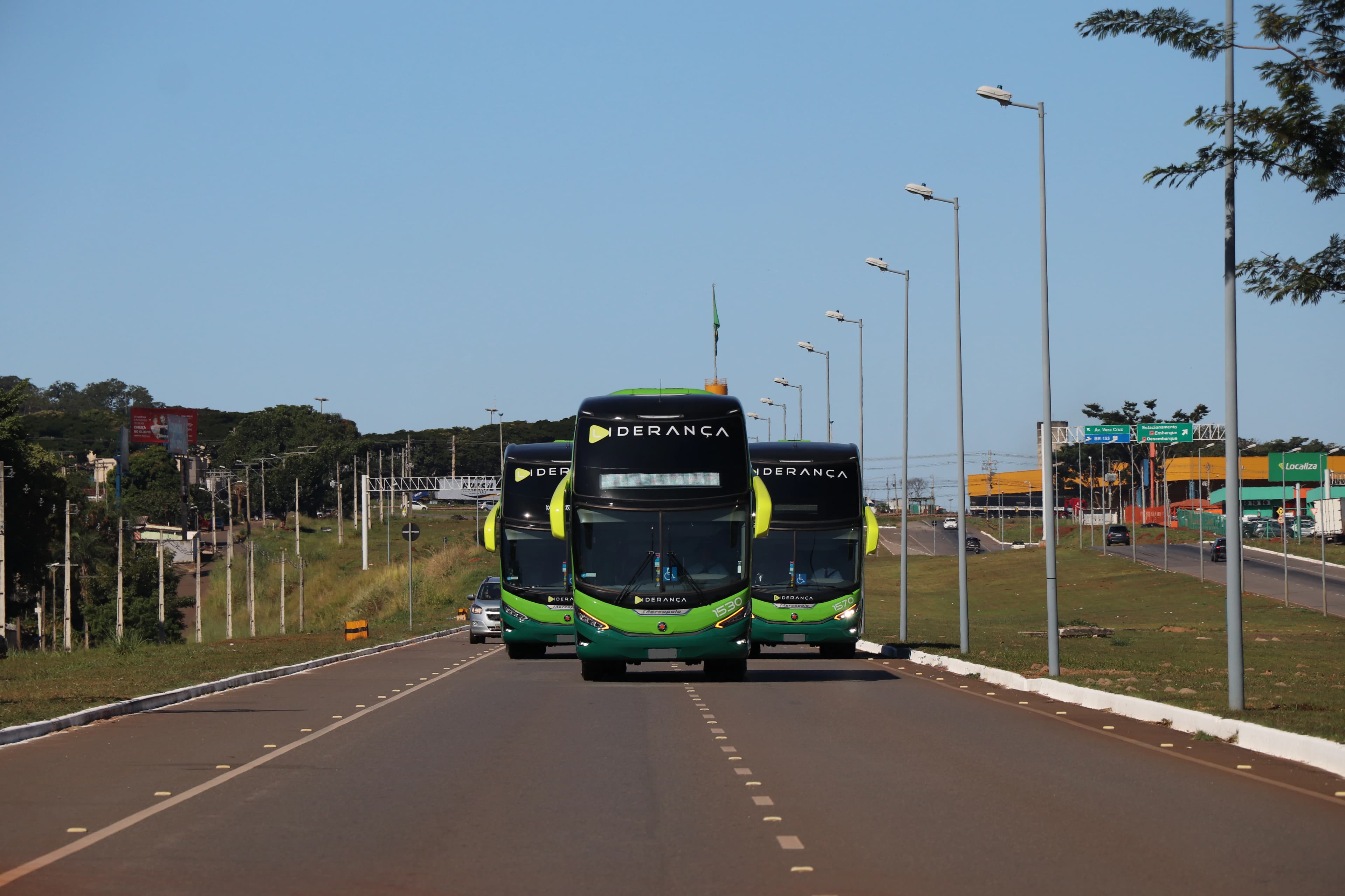 a couple of buses that are sitting in the street