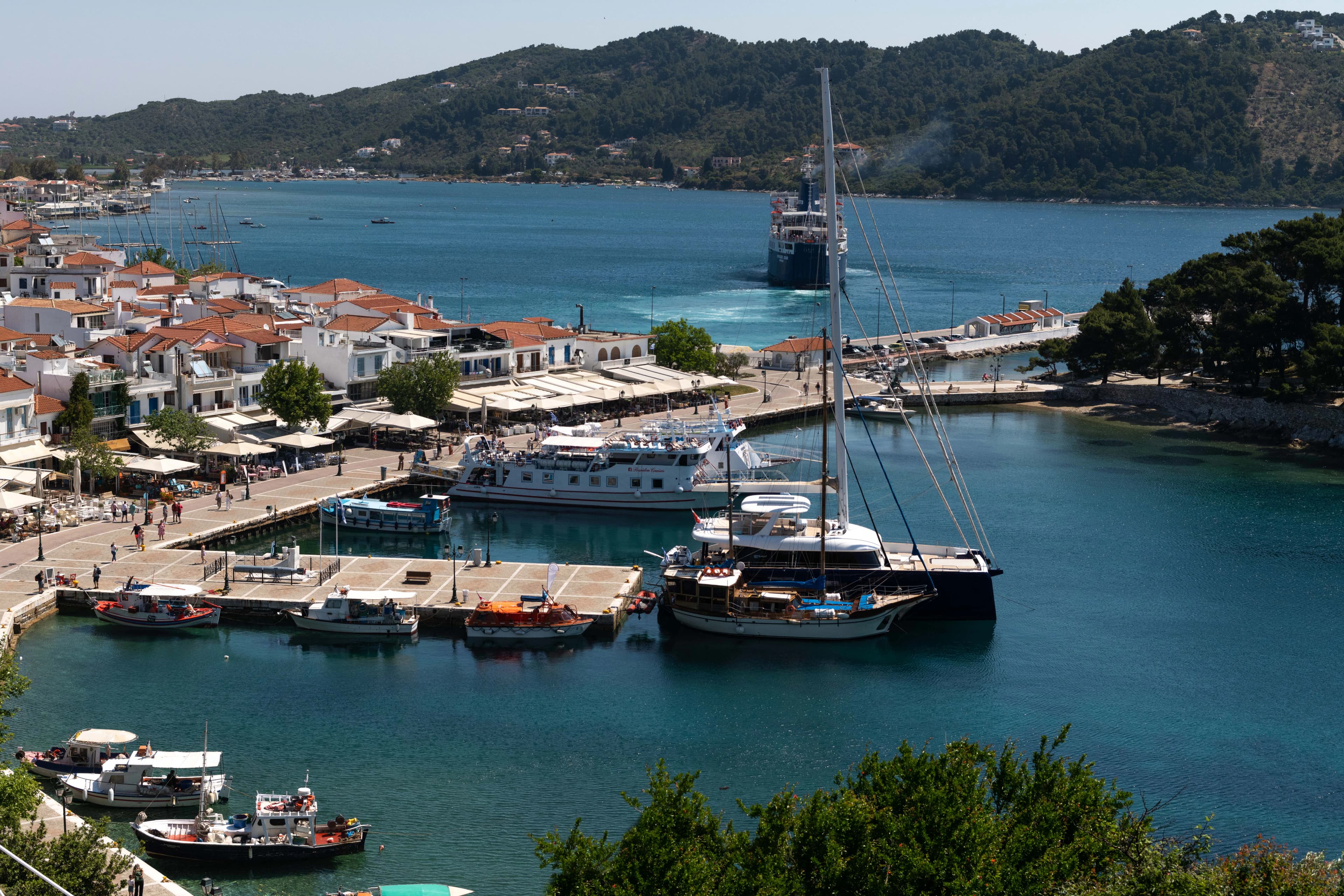 a group of boats docked at a port