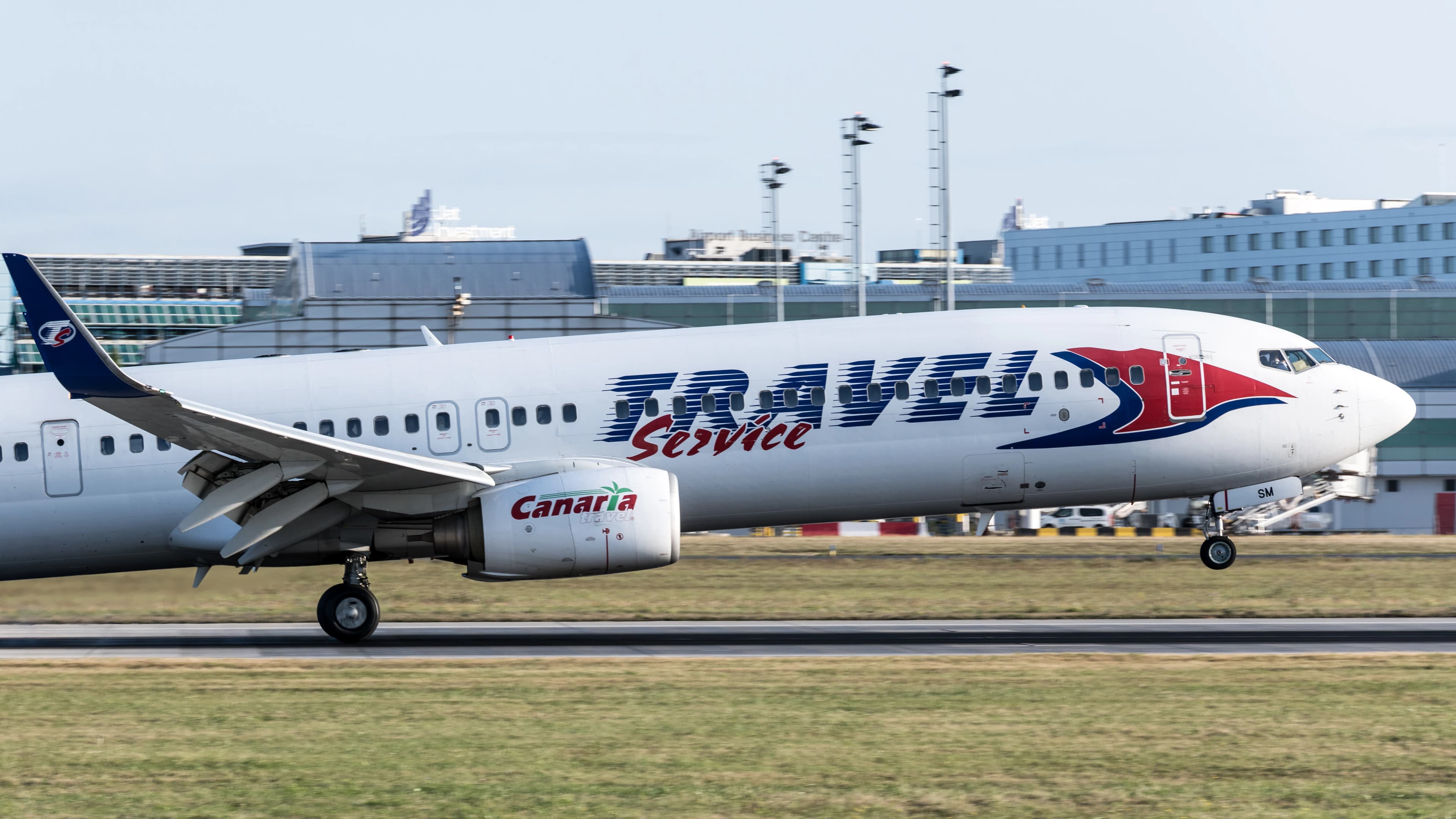 a large passenger jet taking off from an airport runway