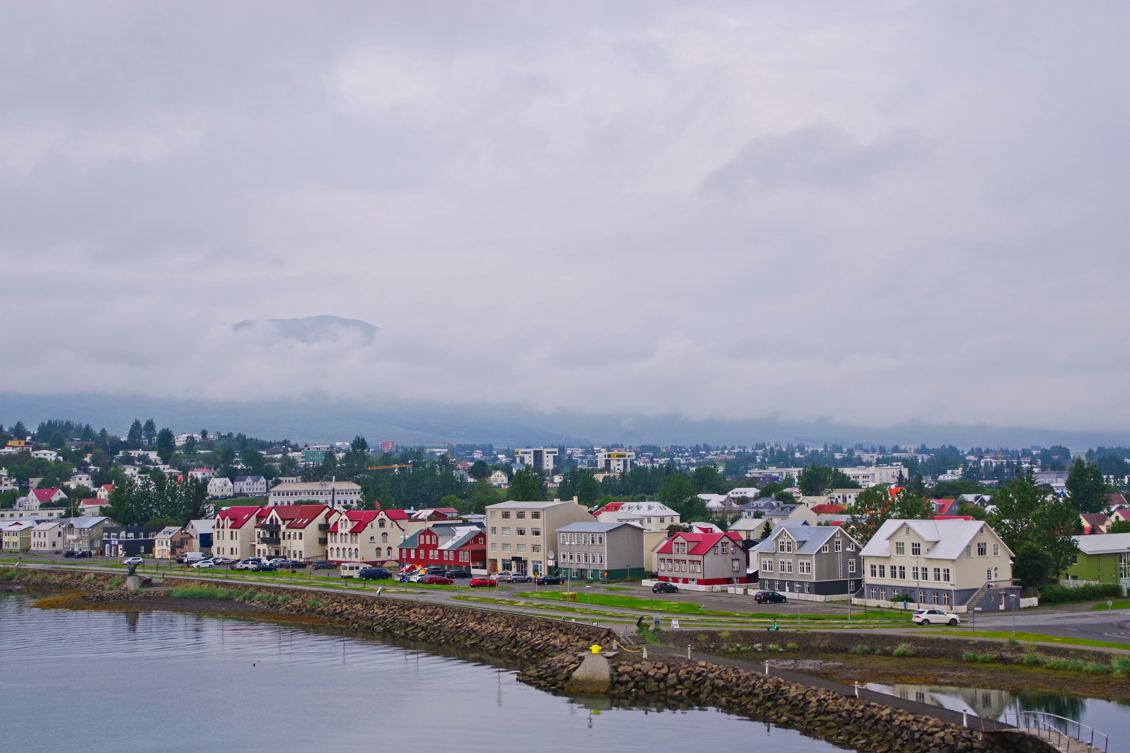 Coastal town with colorful buildings and cloudy sky