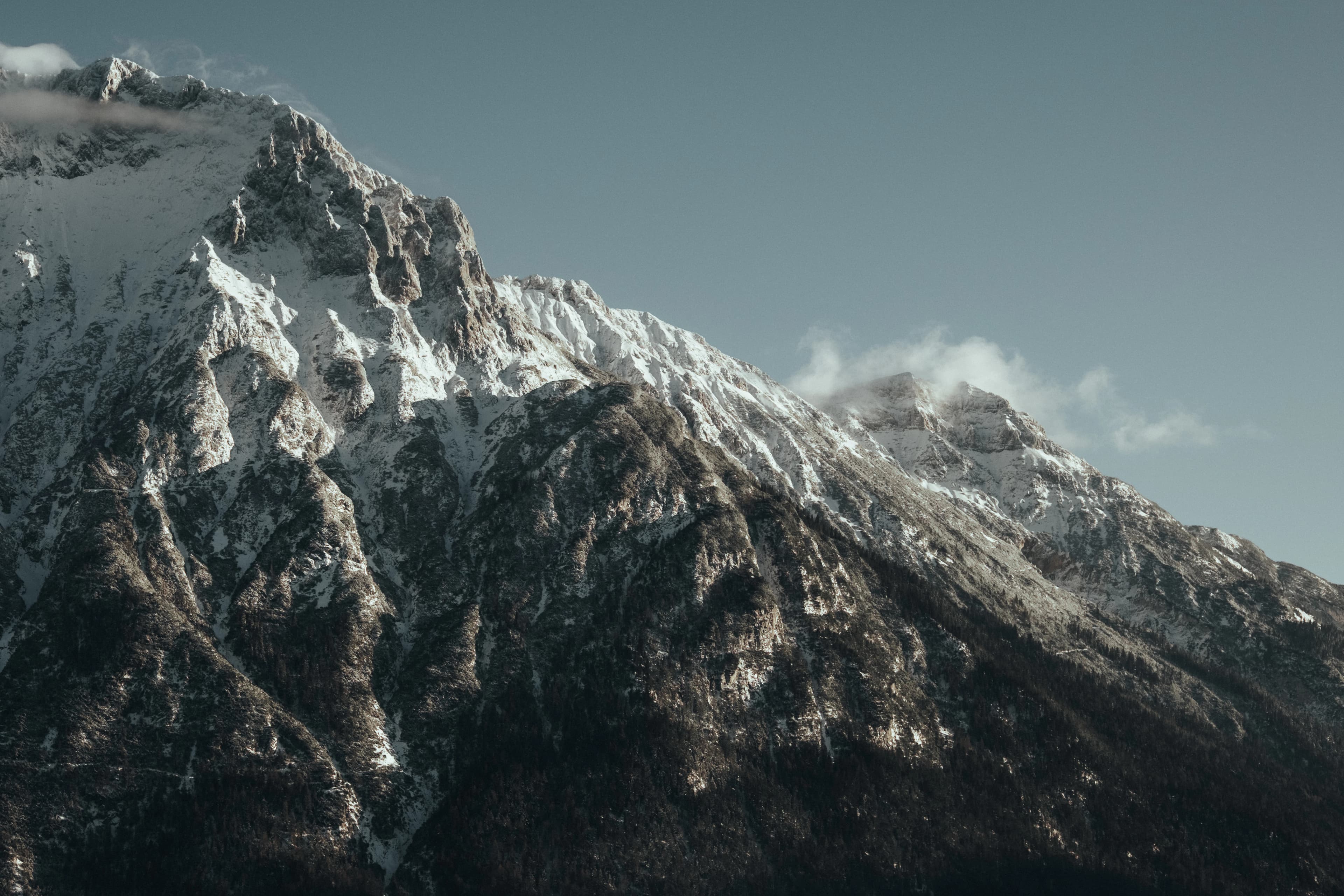 Snow-capped mountain range under a clear blue sky