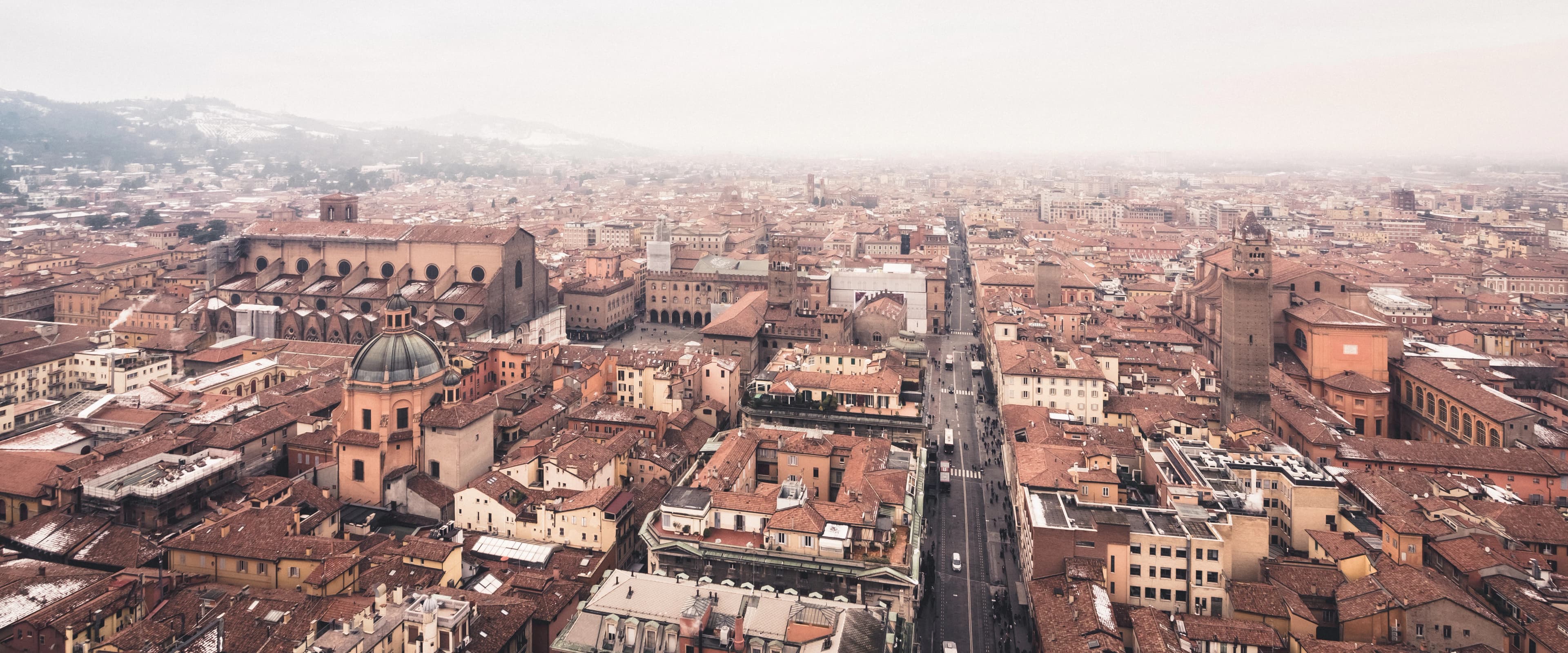 Aerial view of a european city with terracotta roofs.