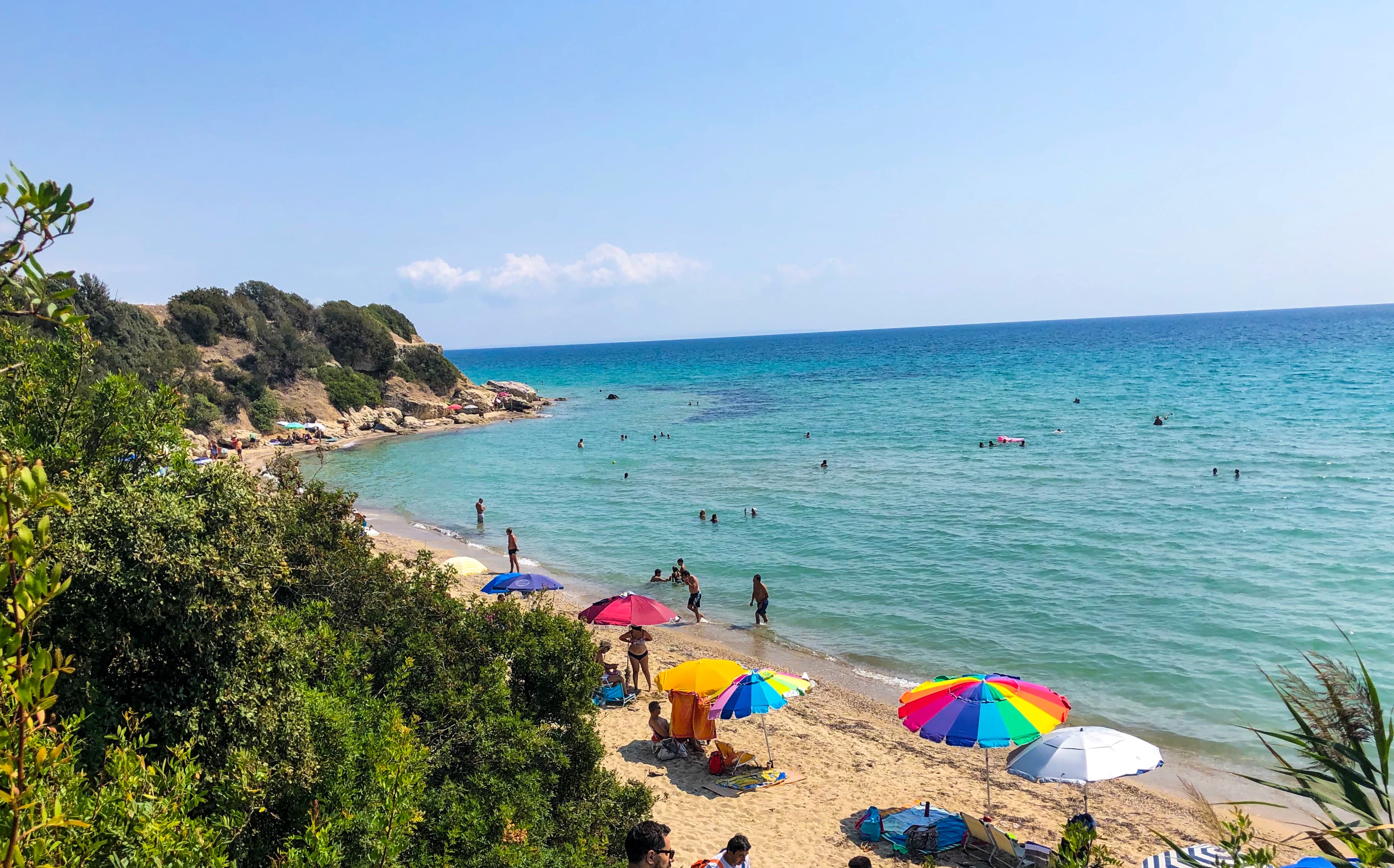 patio umbrellas on shore at daytime