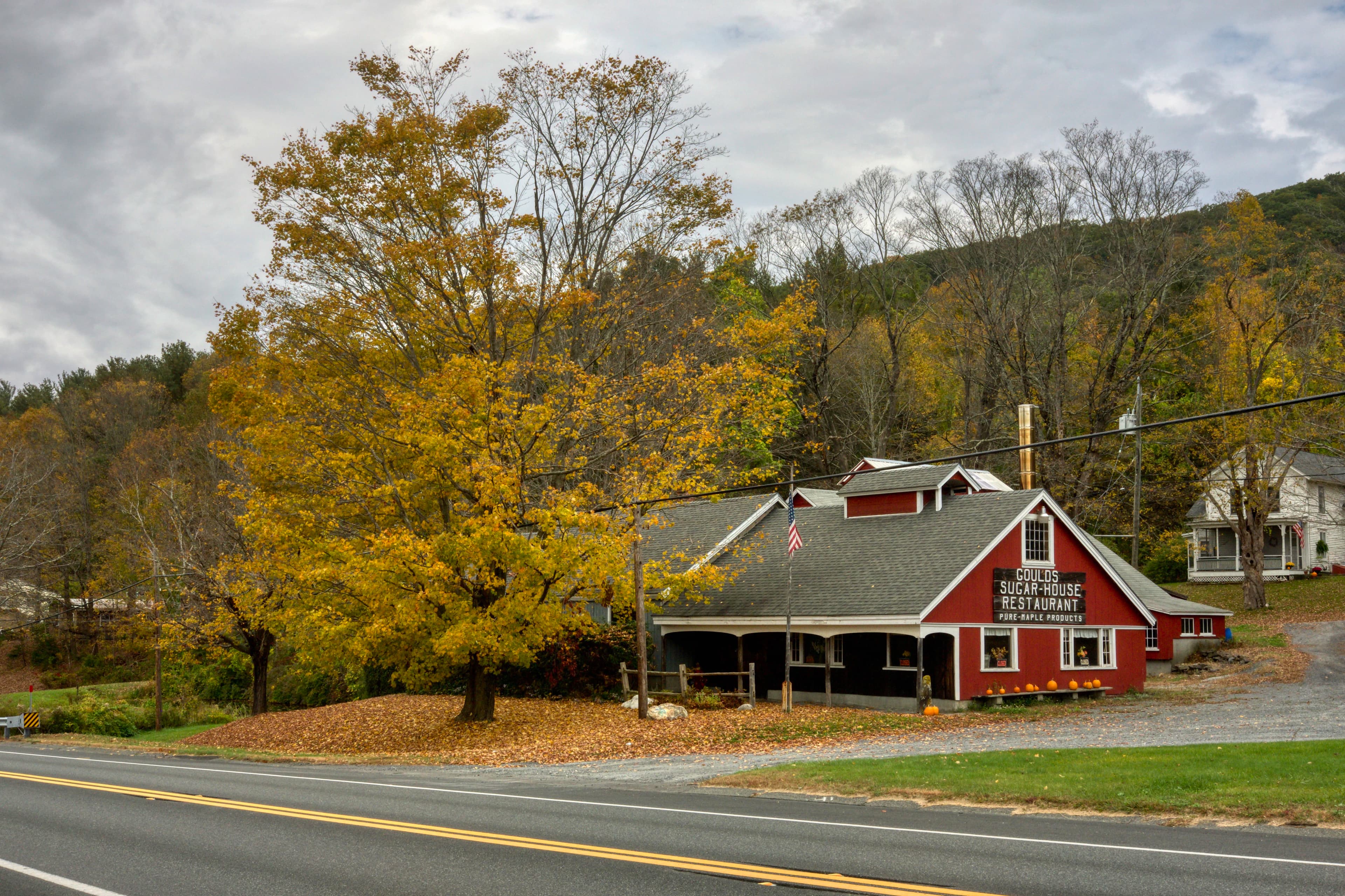 a red building sitting on the side of a road