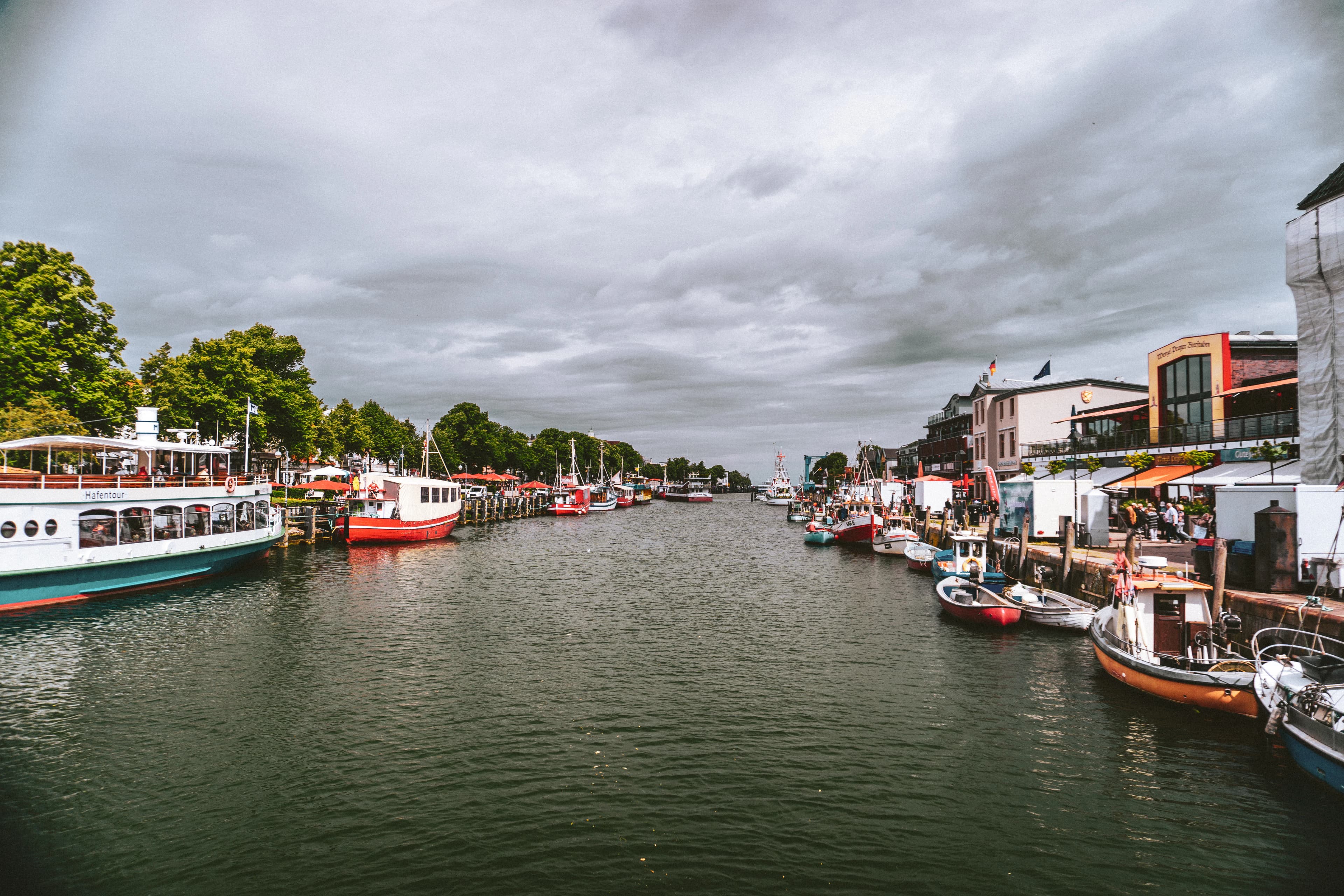 a river filled with lots of boats on top of it