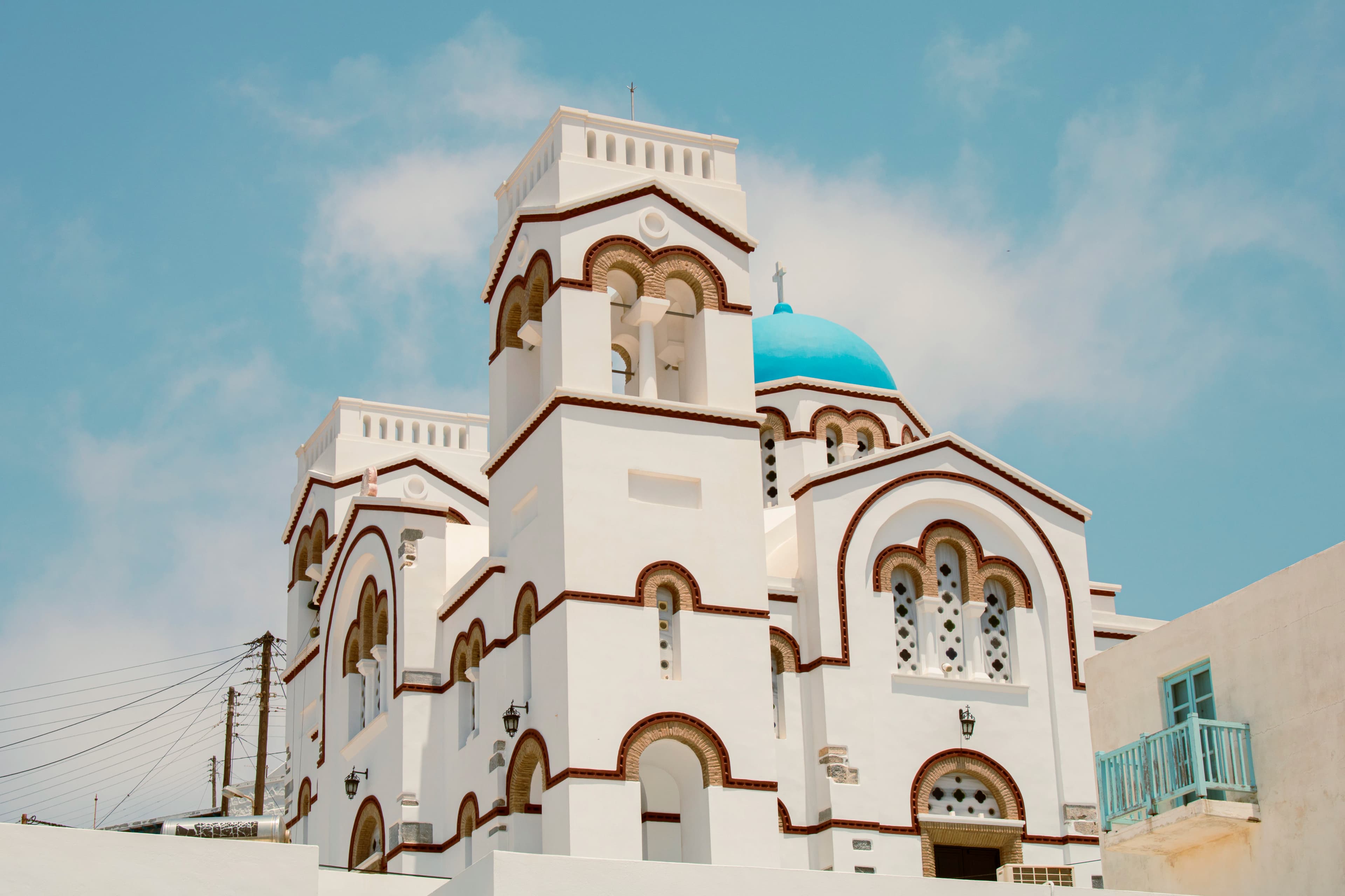 White church with blue dome against sky