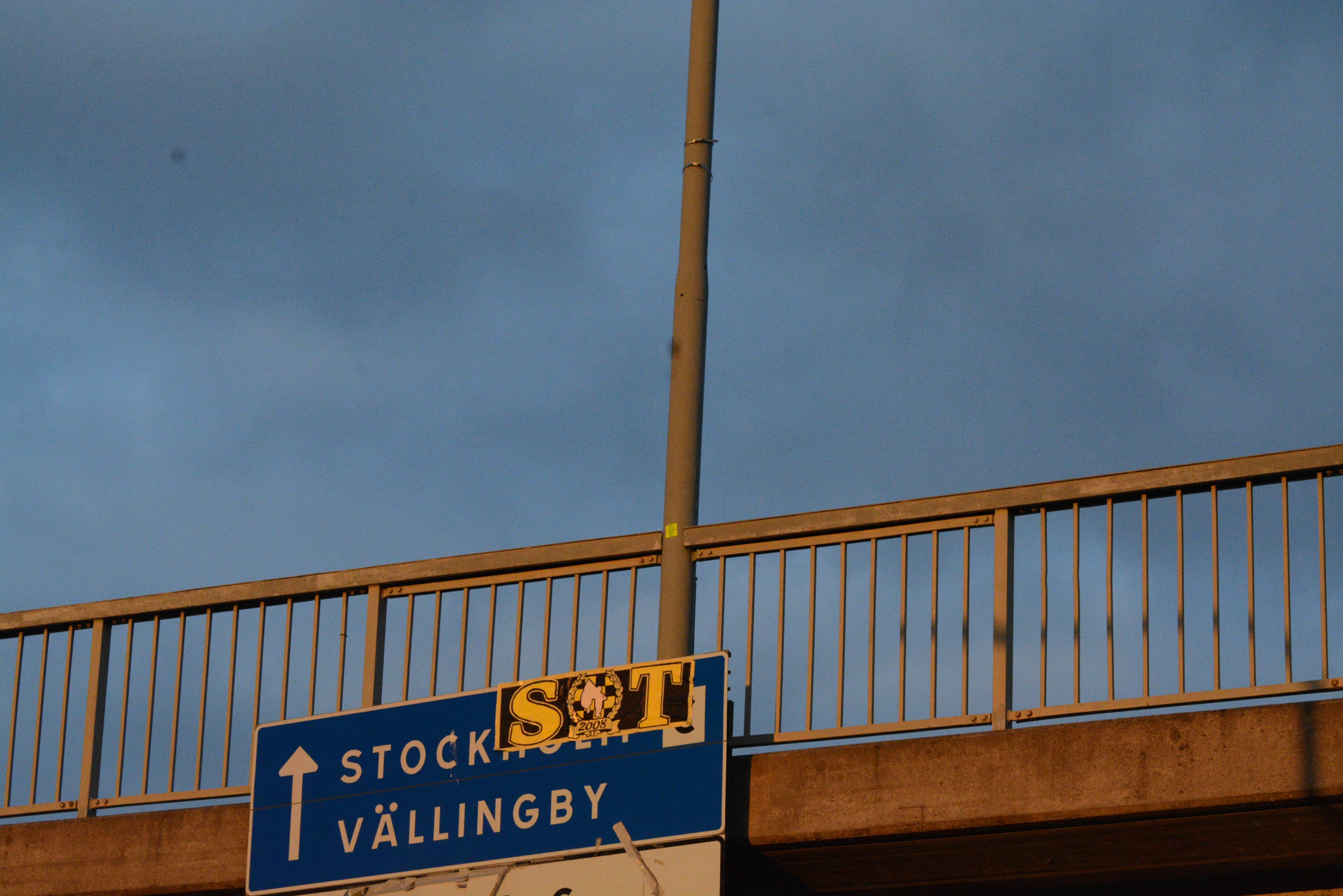 Road sign indicating directions towards stockholm.