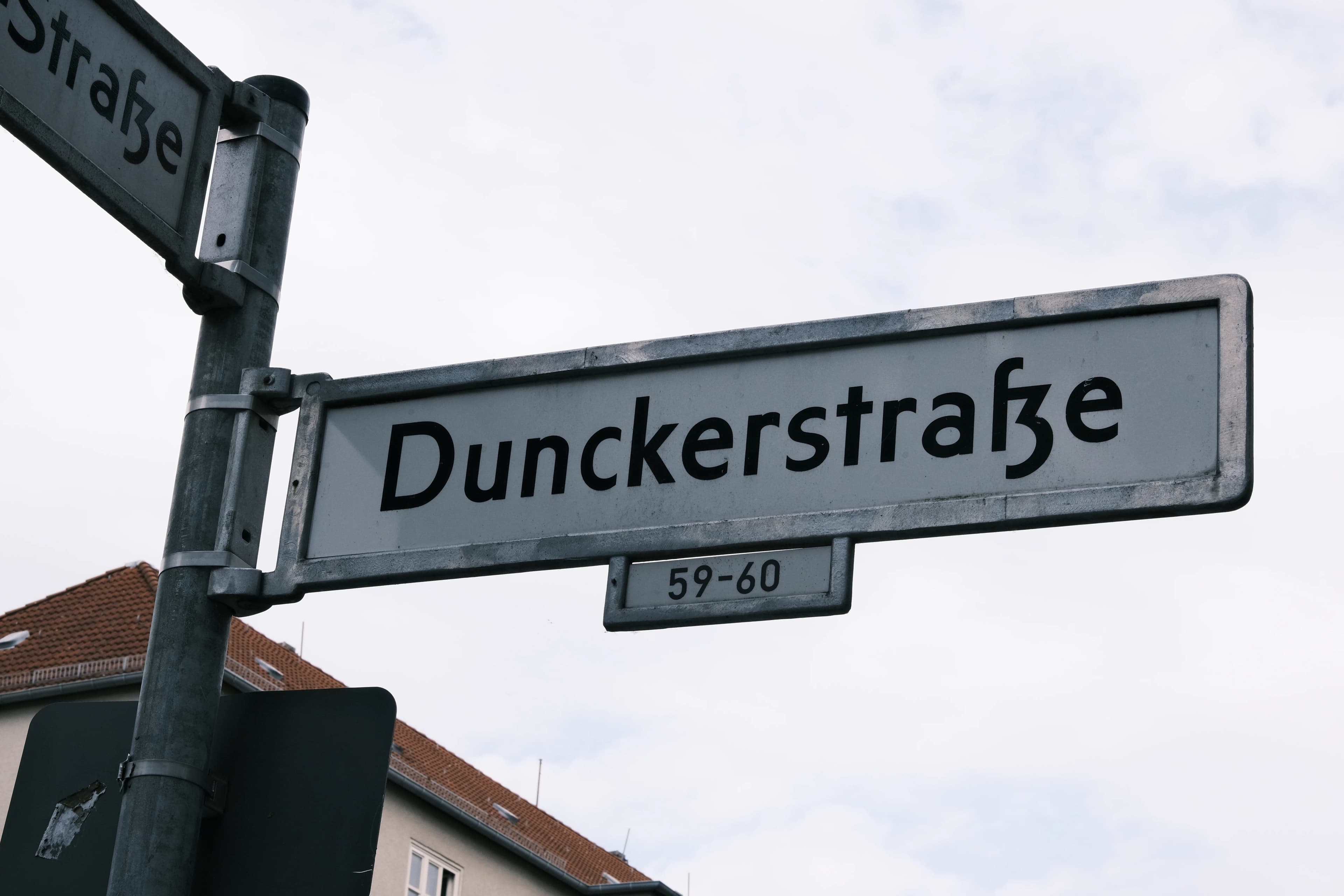 A street sign with a building in the background