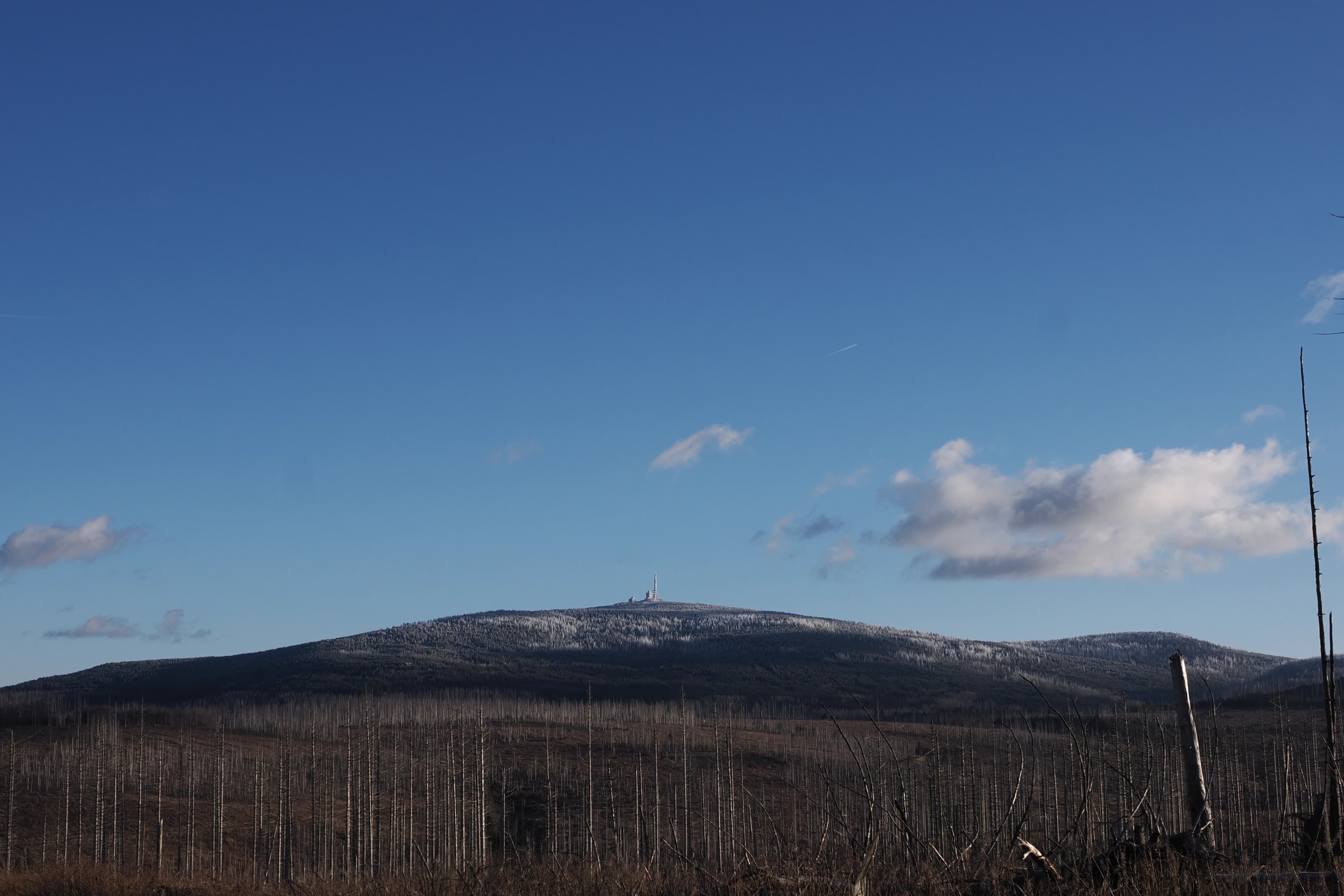 Snow-capped mountain peak under a clear blue sky.