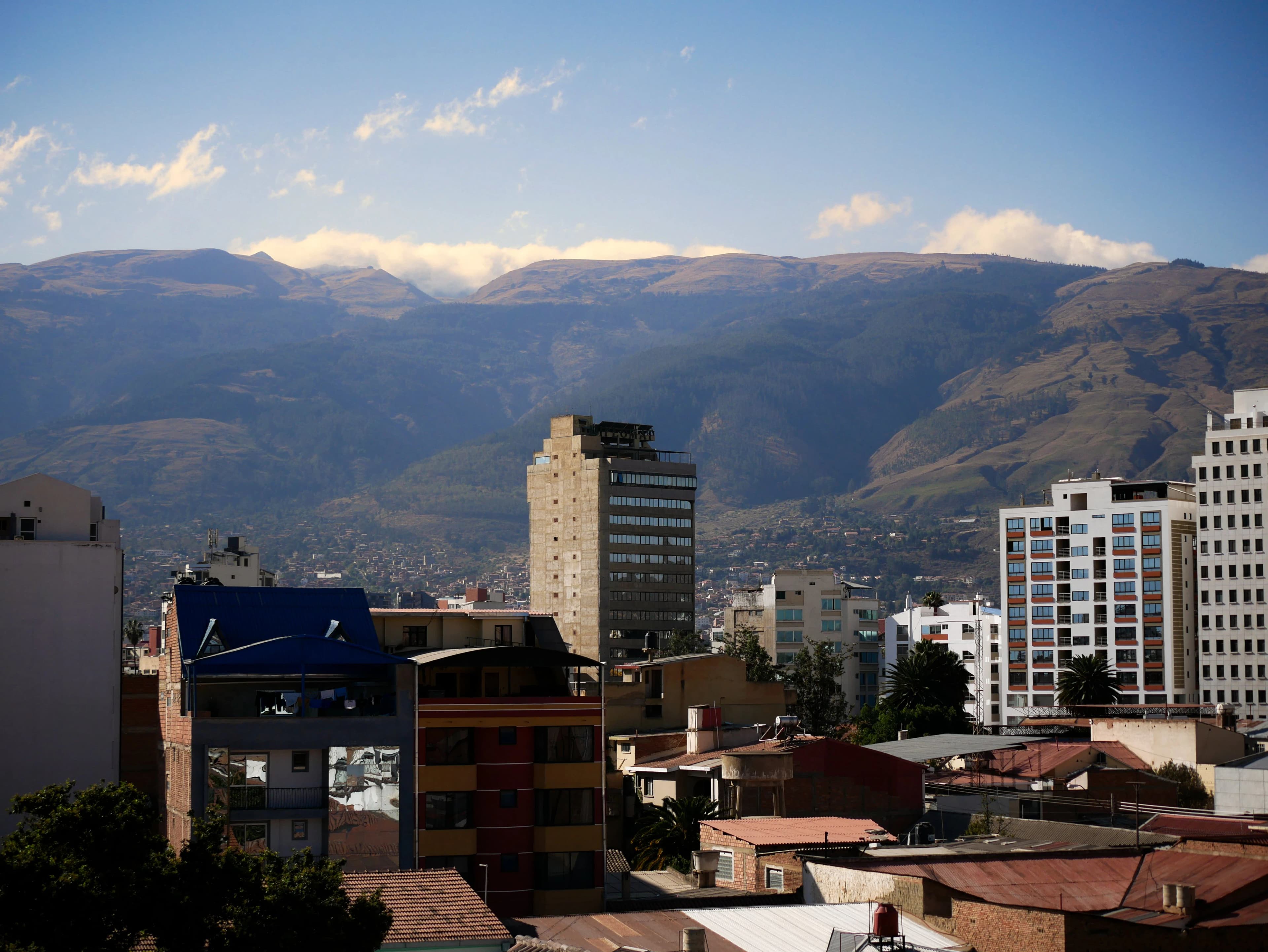 a view of a city with mountains in the background