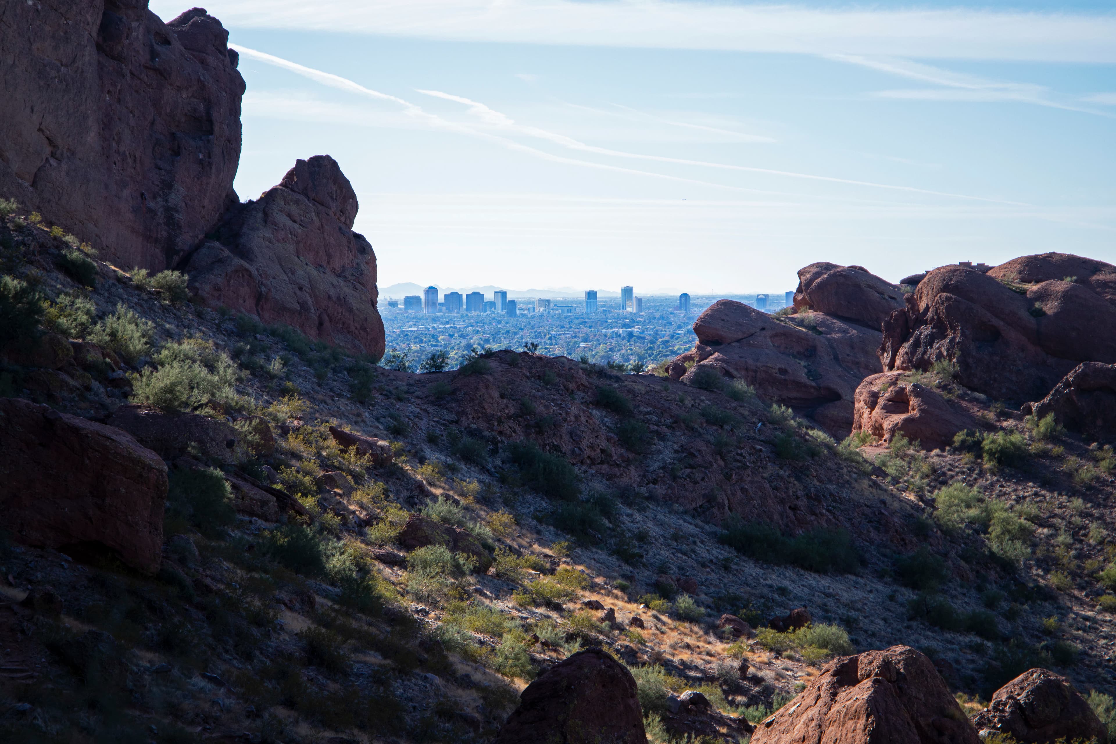 a view of the city from the top of a mountain