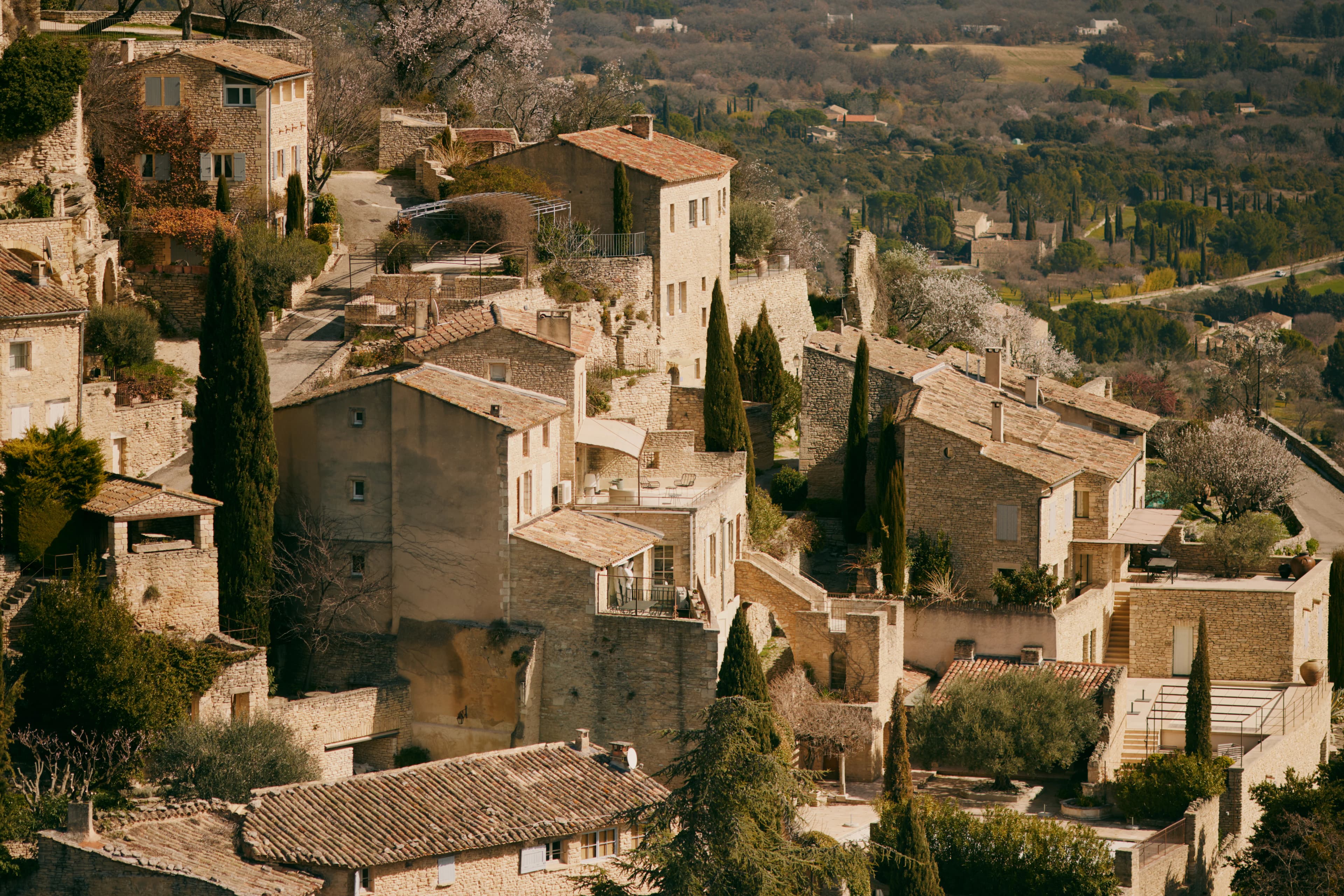 A quaint village sits atop a hill.