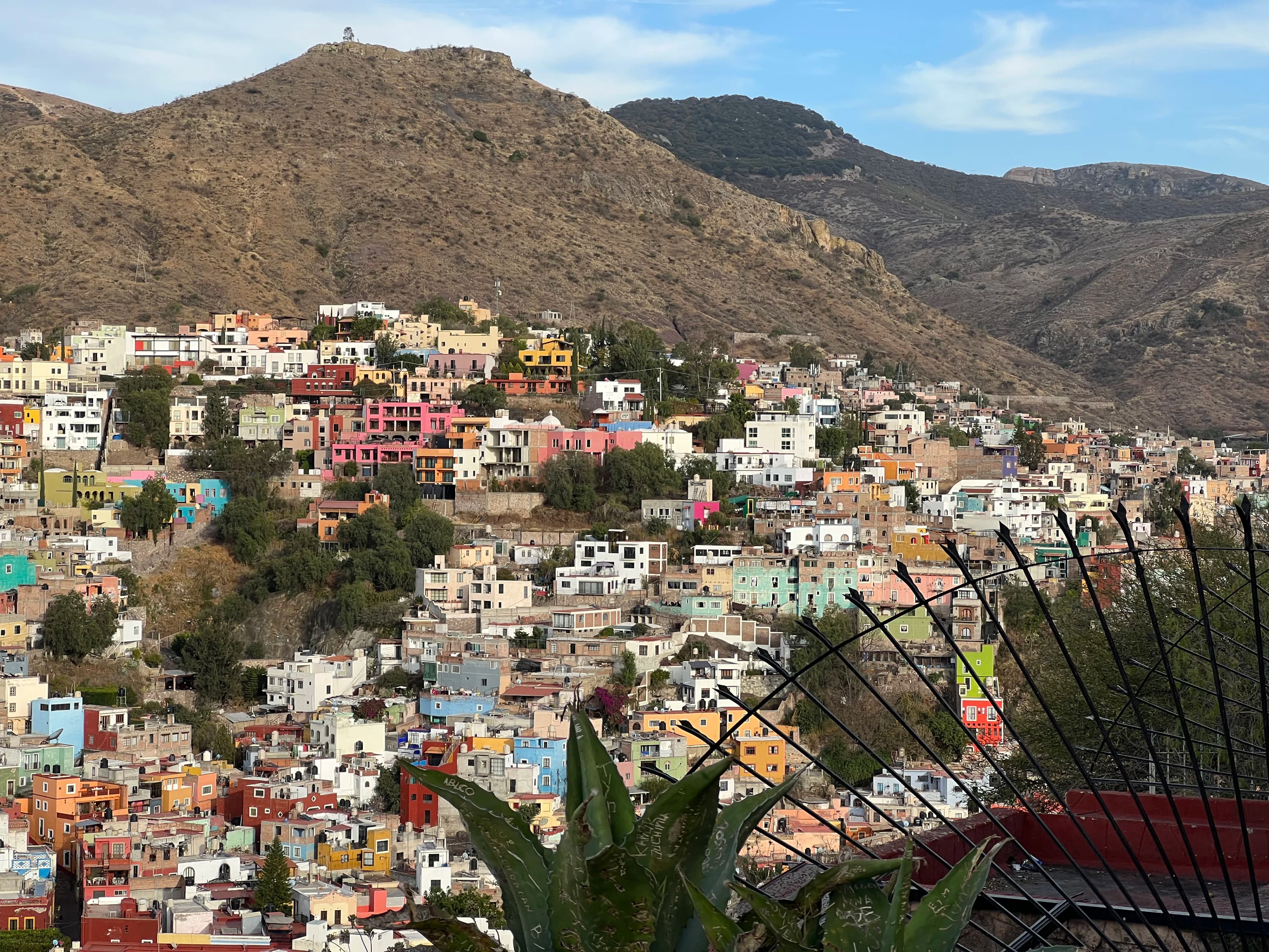 a view of a city with mountains in the background