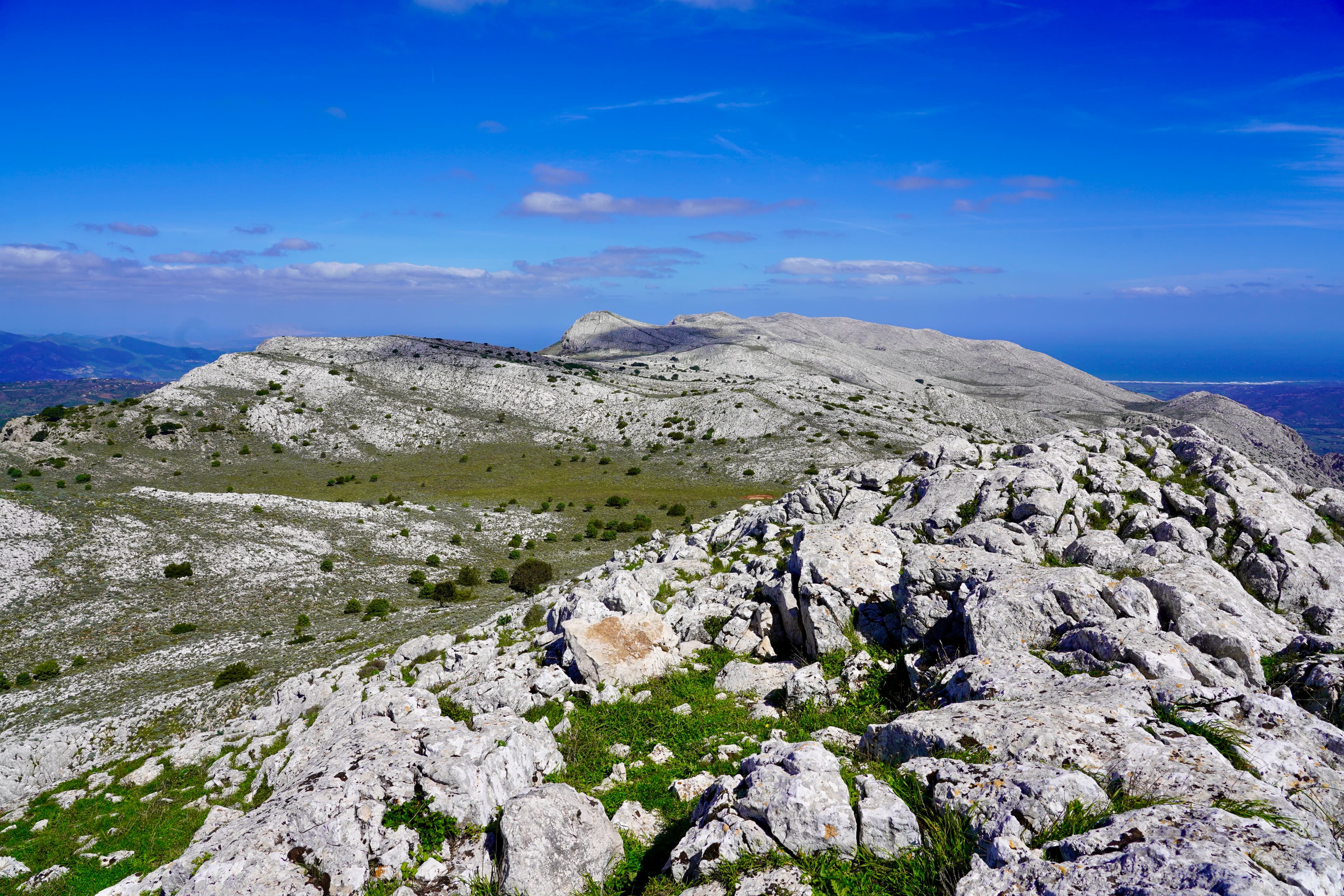 gray rocky mountain under blue sky during daytime