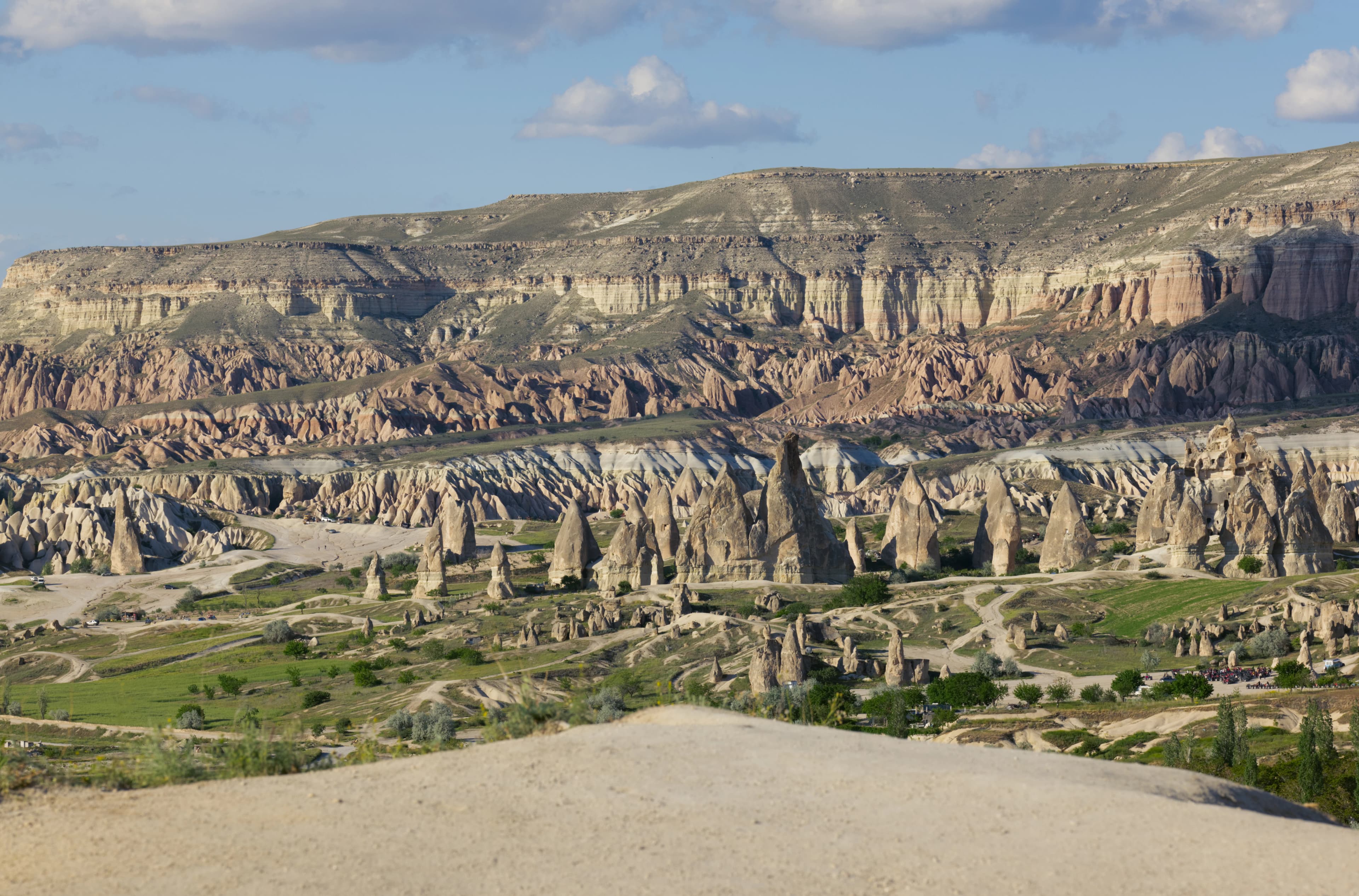 A scenic view of a valley and mountains