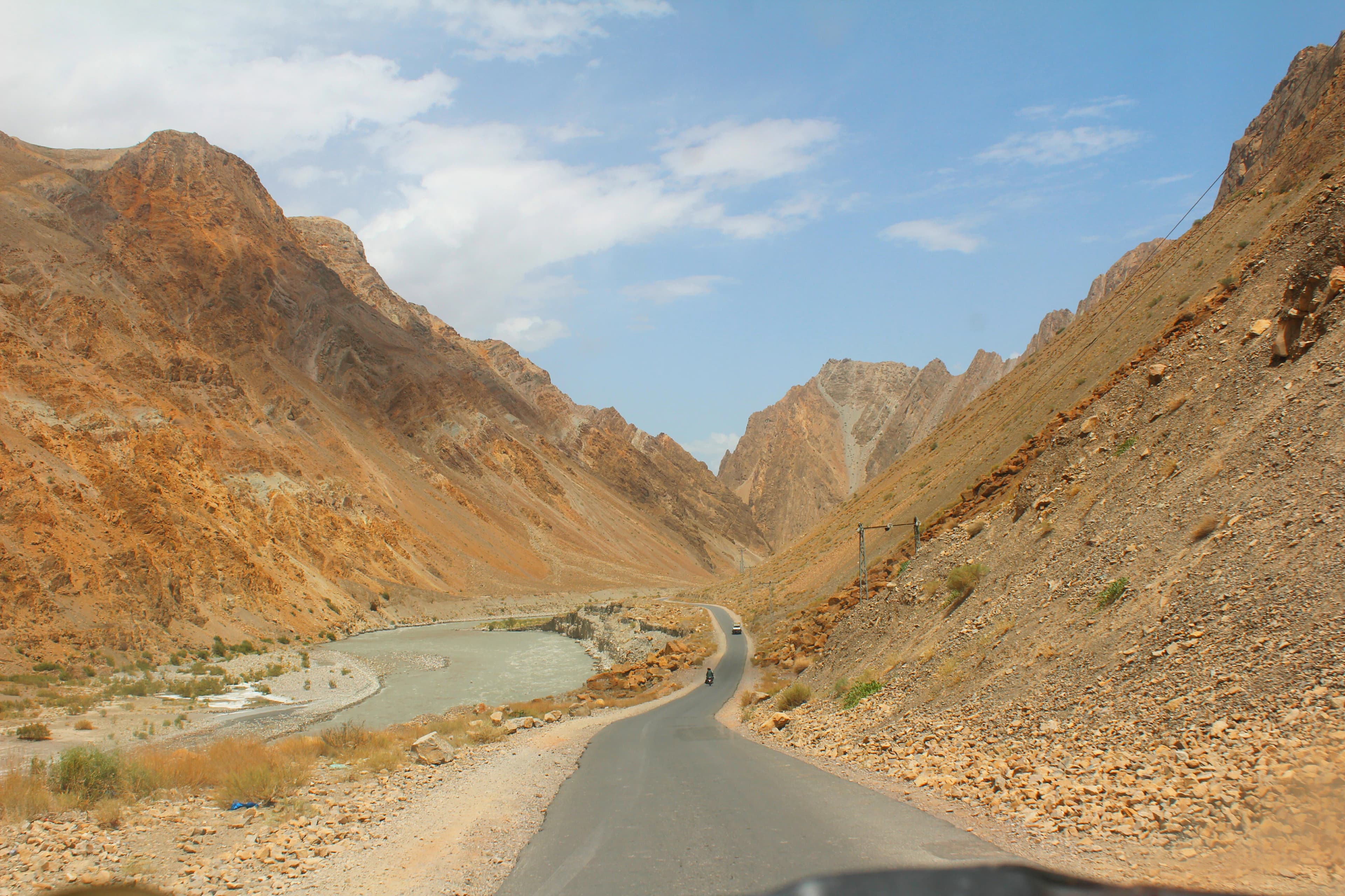 a view of a road in the mountains from a vehicle