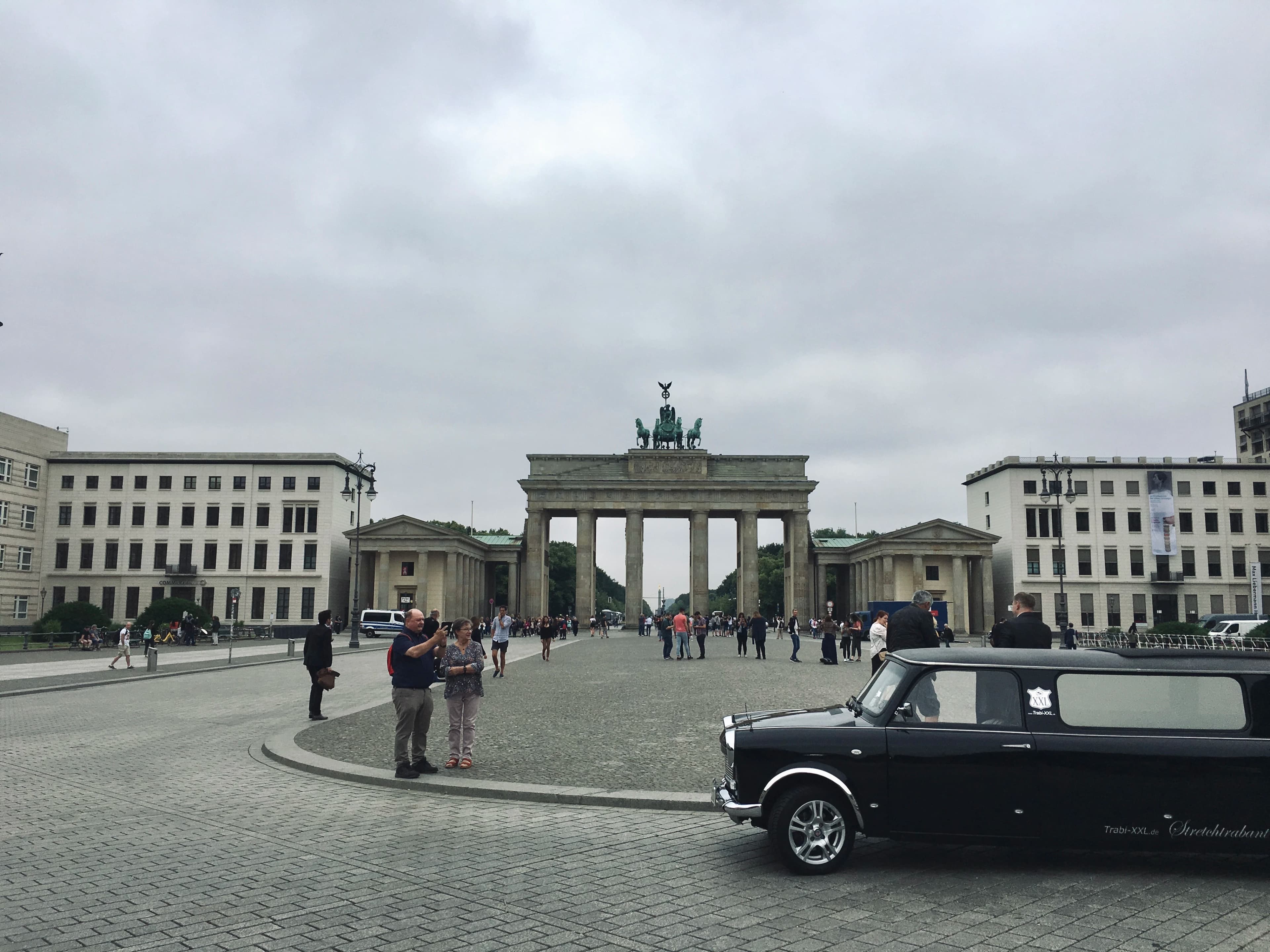 a black car parked in front of a building
