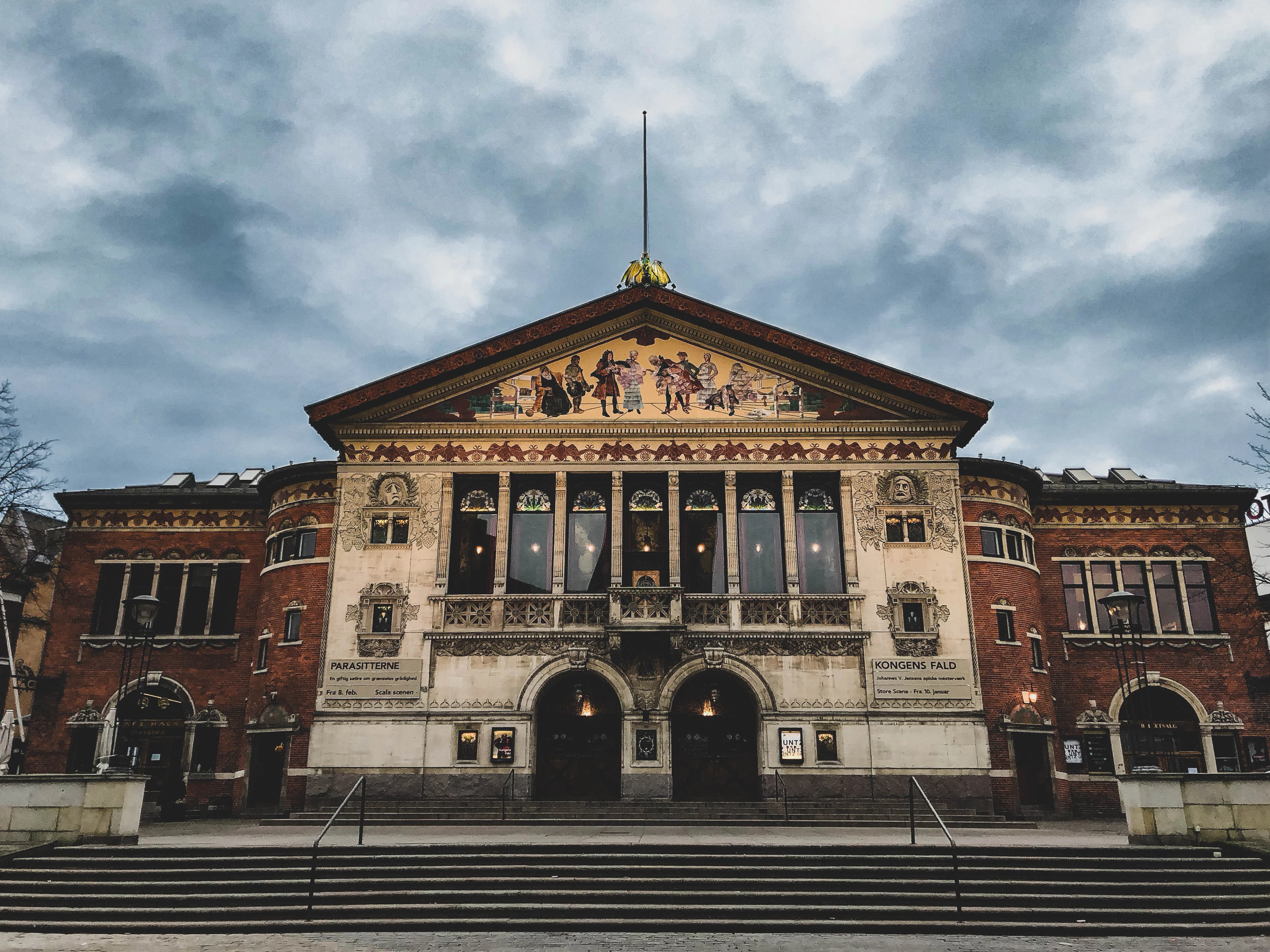 view of architectural building under cloudy sky
