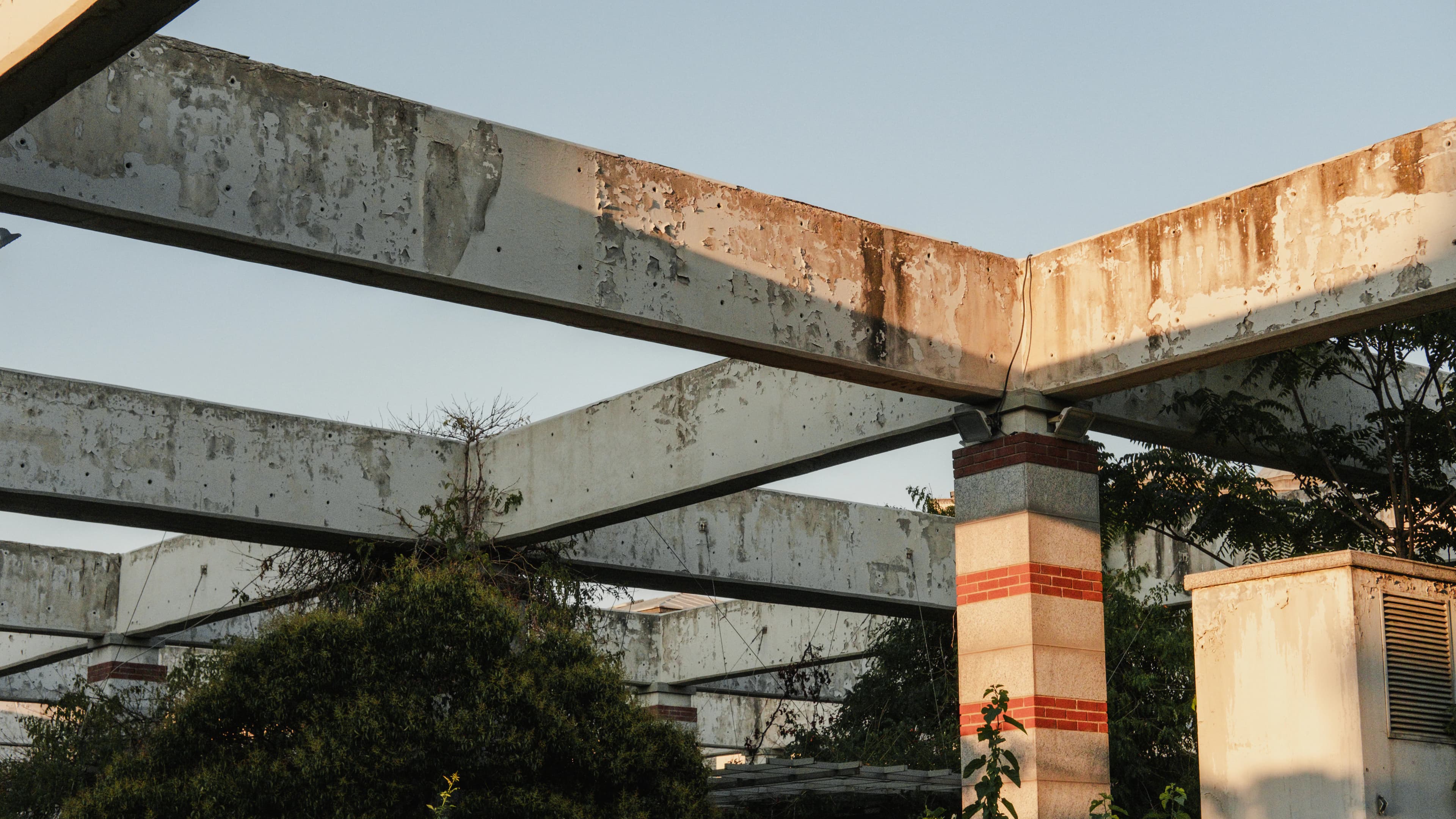 A stop sign that is on the side of a building