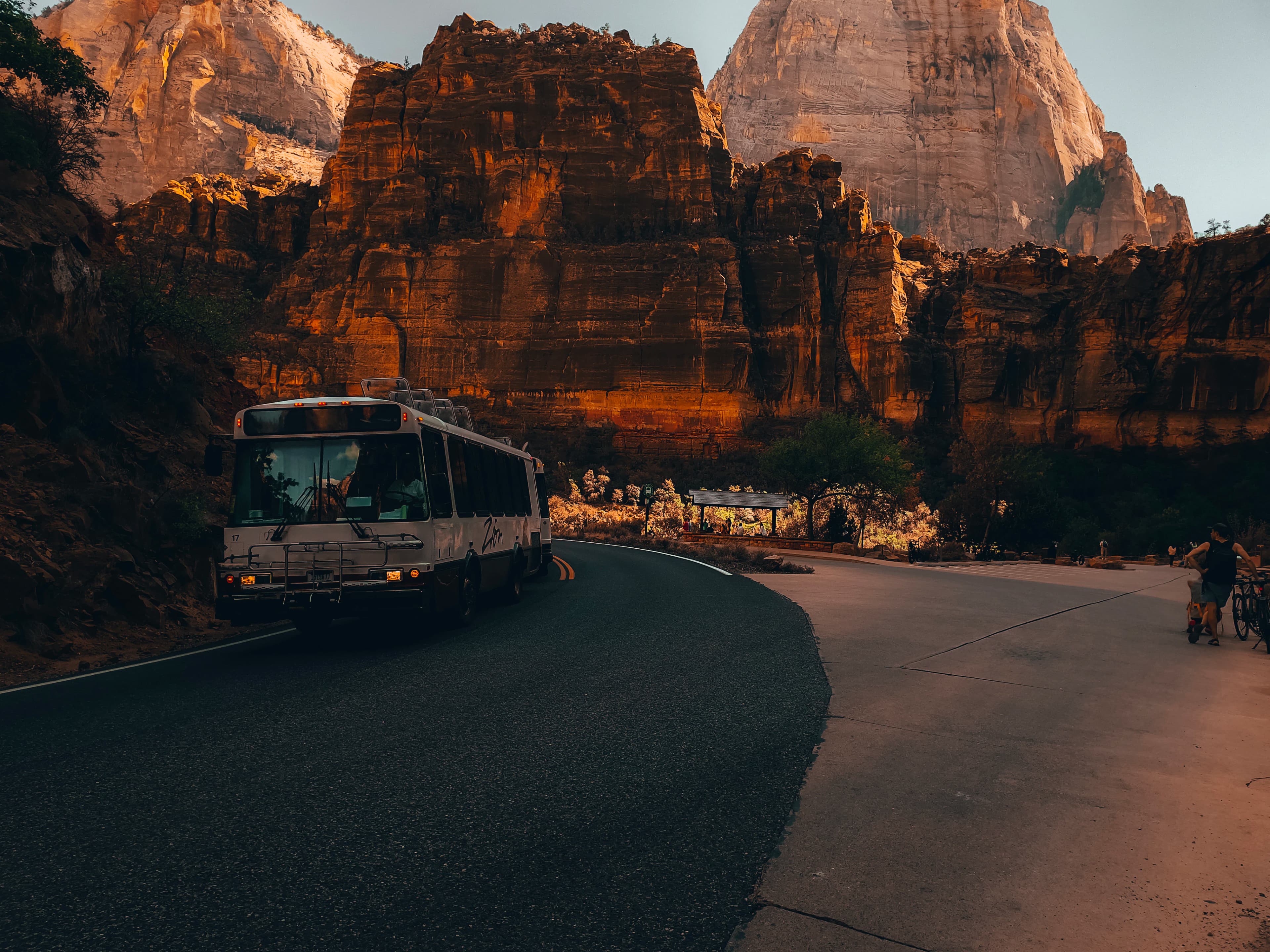 a bus driving through a canyon
