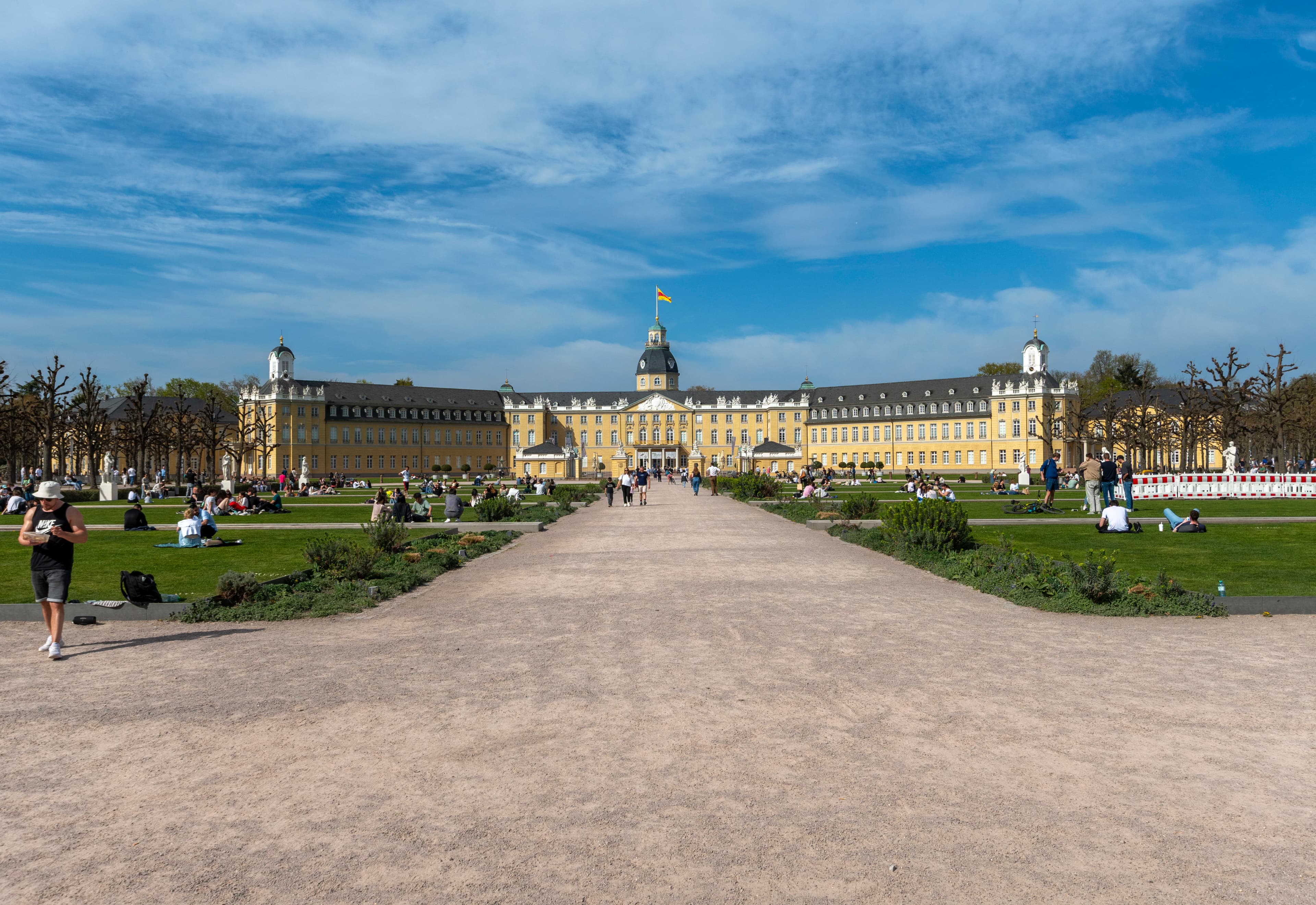 A beautiful palace and green fields under a blue sky.